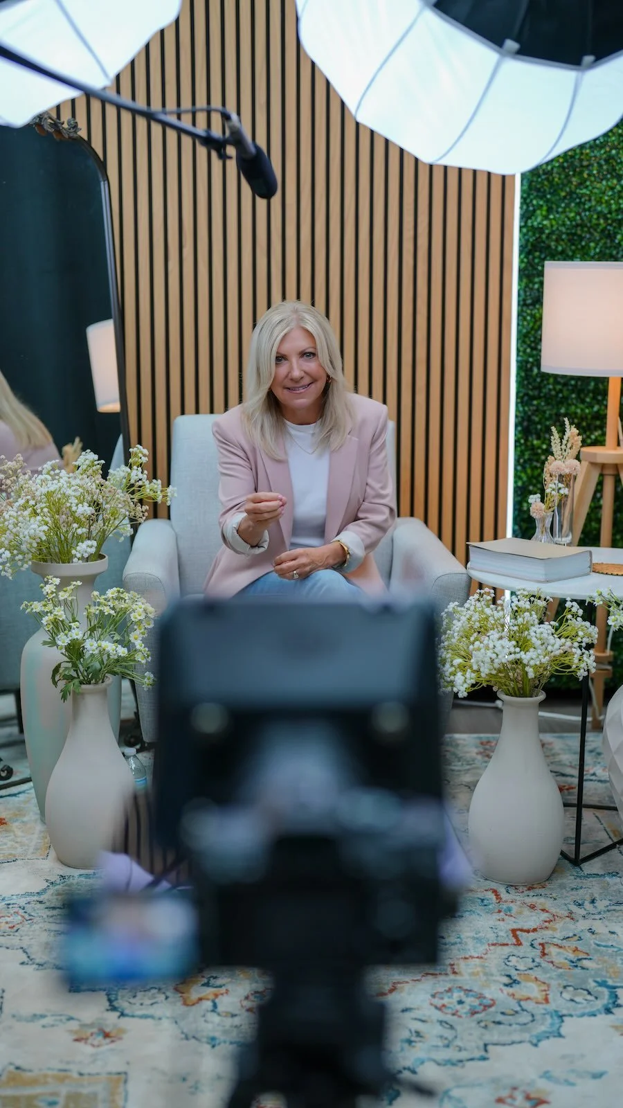 A woman being filmed in a talking-head video session at Noble Frequency studio in Temecula–Murrieta.
