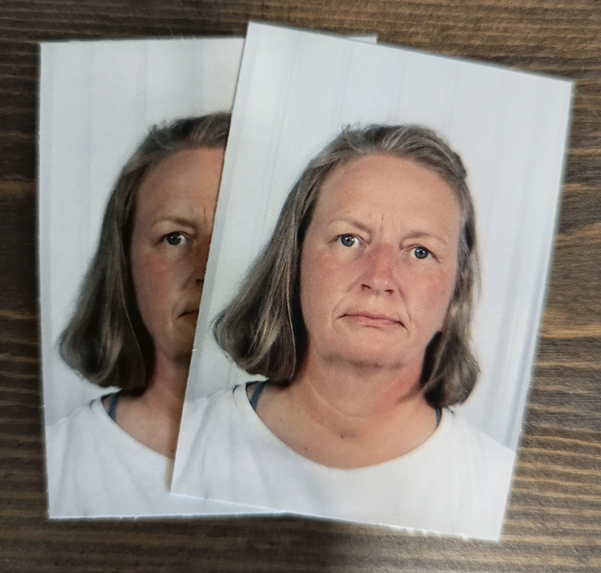 Two photographs of a woman with blonde hair and blue eyes, placed on a wooden surface.