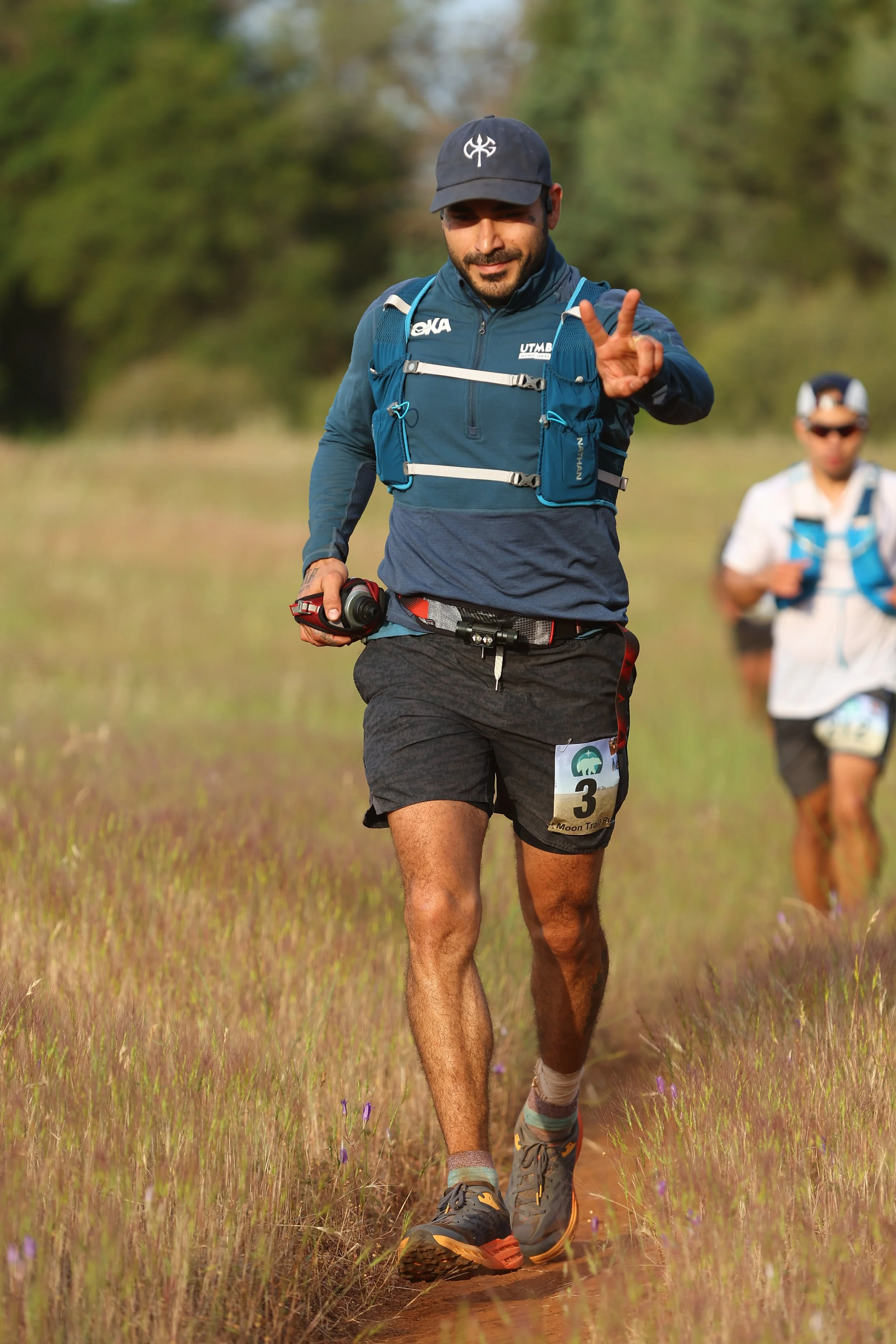 Trail runner running 100 miles on single track trail.