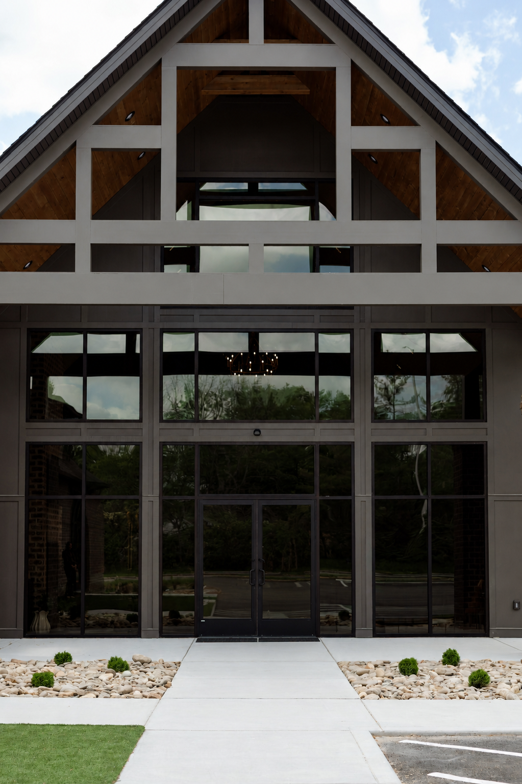 Legacy Family Dental building entrance with large glass doors and a landscaped walkway.