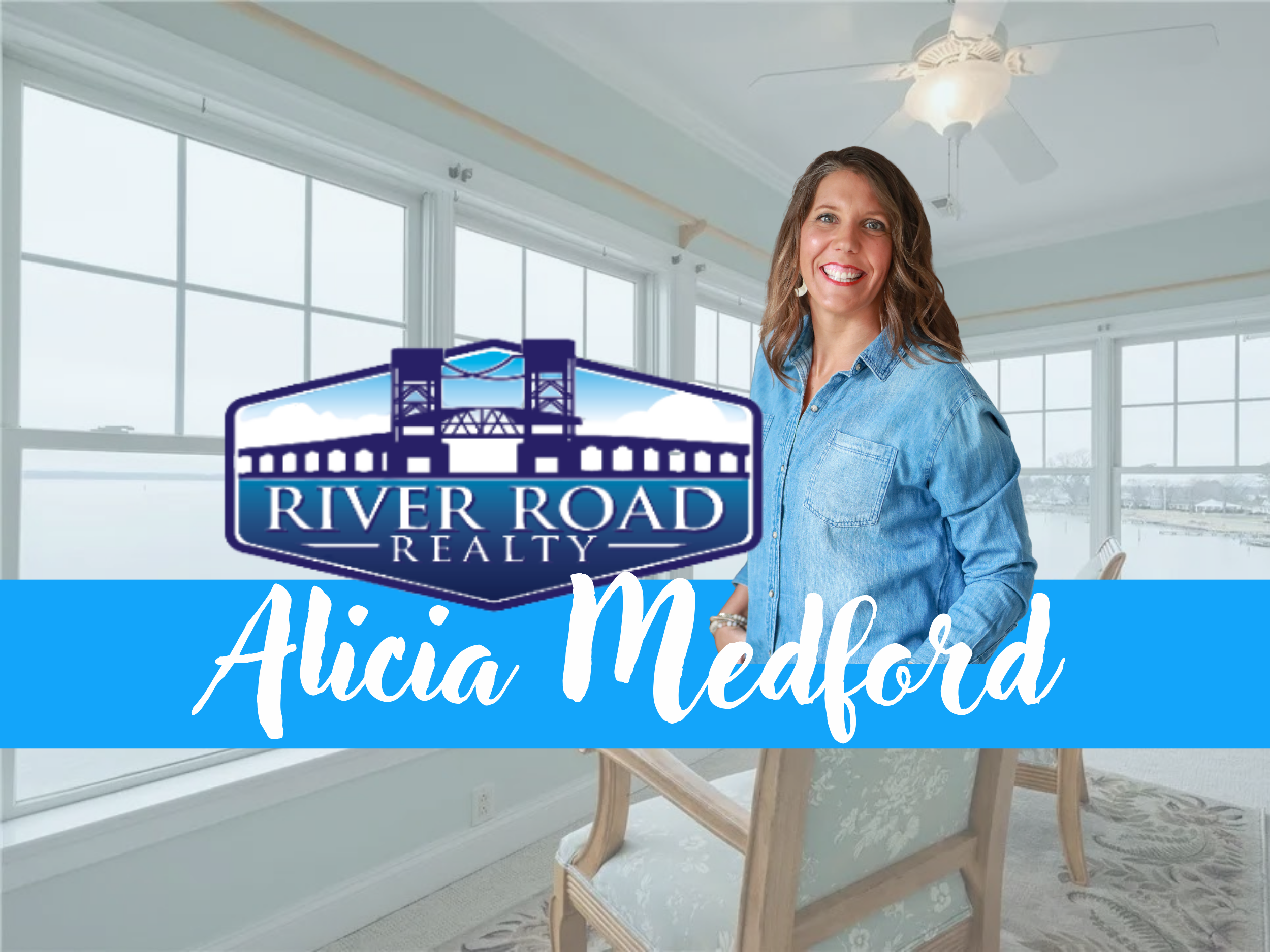 Logo for Alicia Medford from River Road Realty. A smiling woman with wavy, shoulder-length hair wearing a denim shirt, standing indoors in front of large windows.
