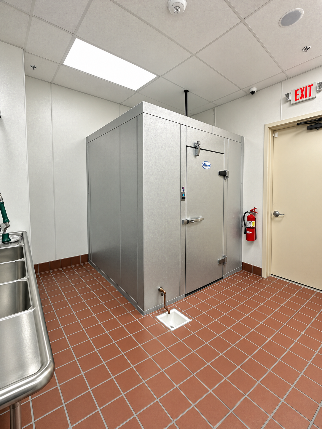 Clean Commercial Walk-In Cooler Room.png