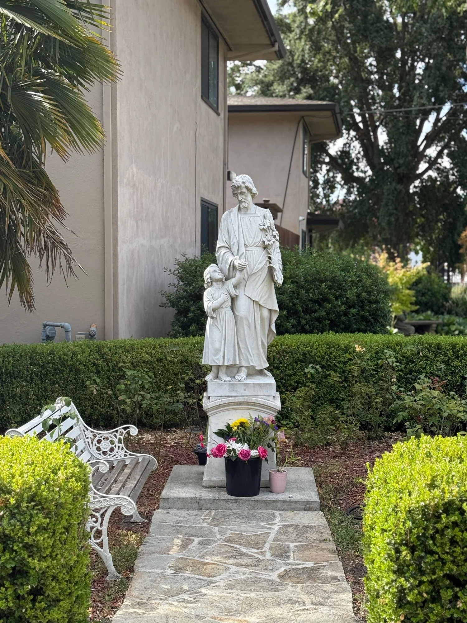 Statue of St Joseph and the child Jesus on the grounds of St Eugene in Santa Rosa