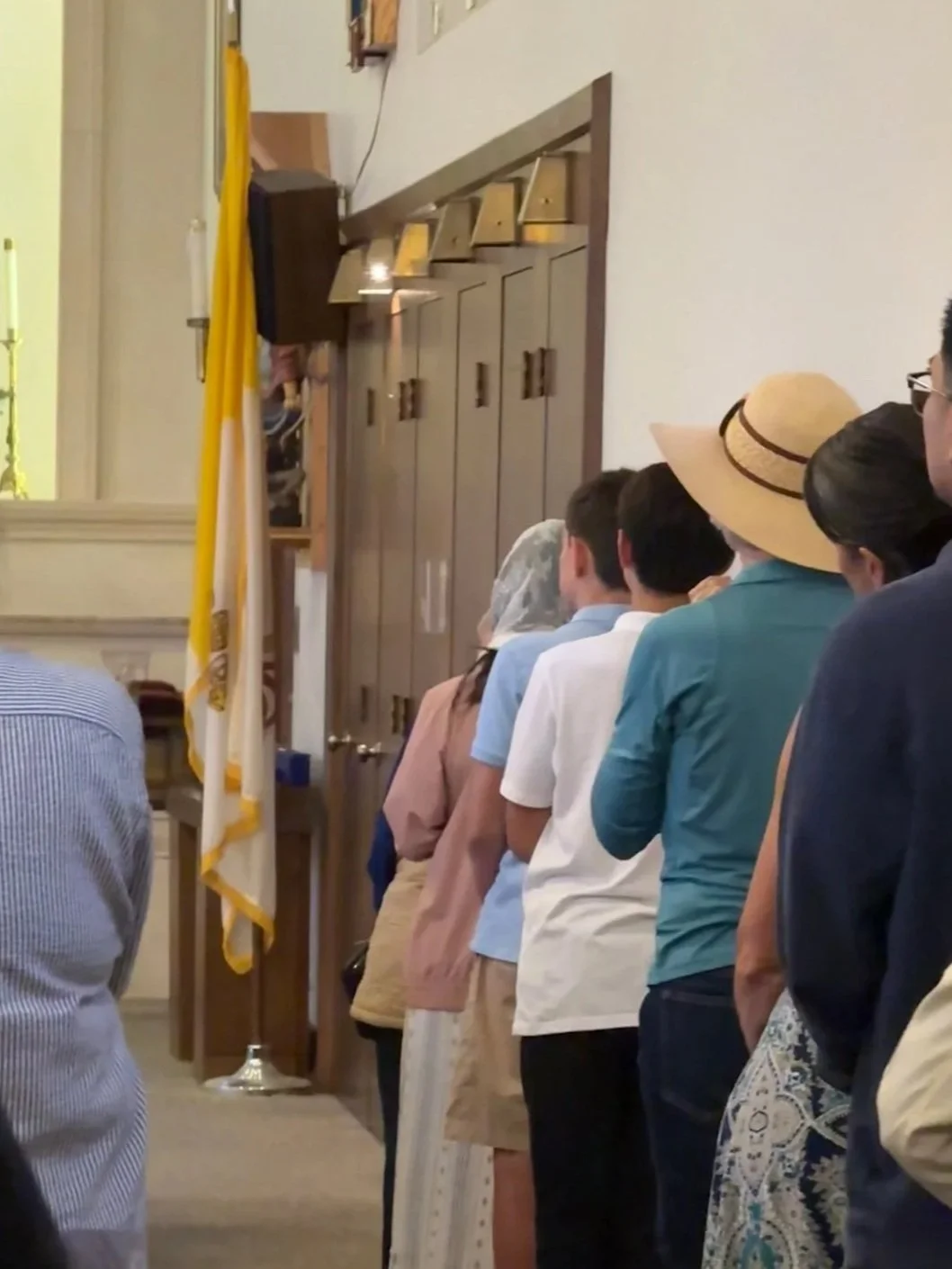 Parishioners standing in line for confession at St Eugene's