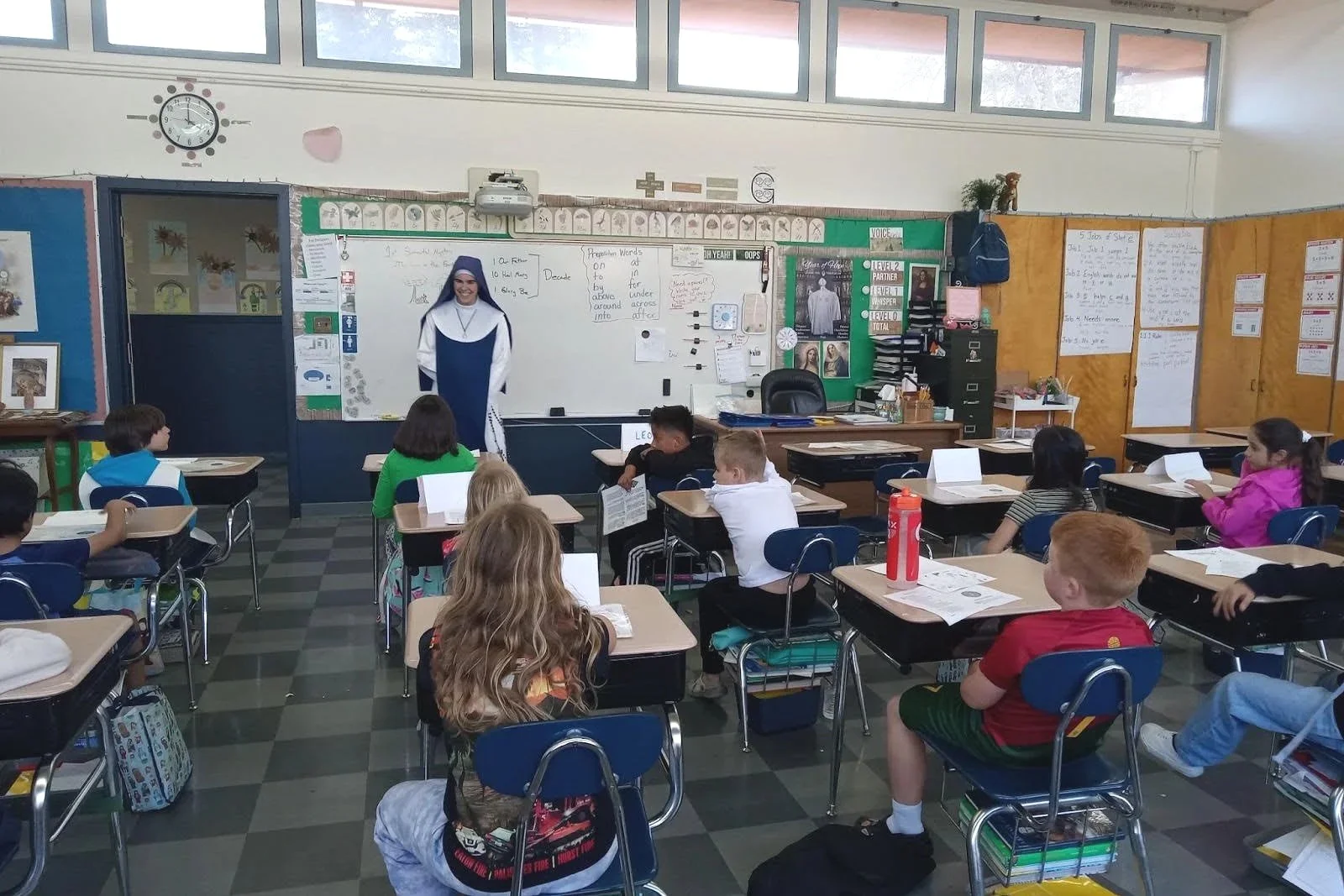 A classroom with students sitting at desks during a Parish School of Religion class led by one of the Marian Sisters of Santa Rosa