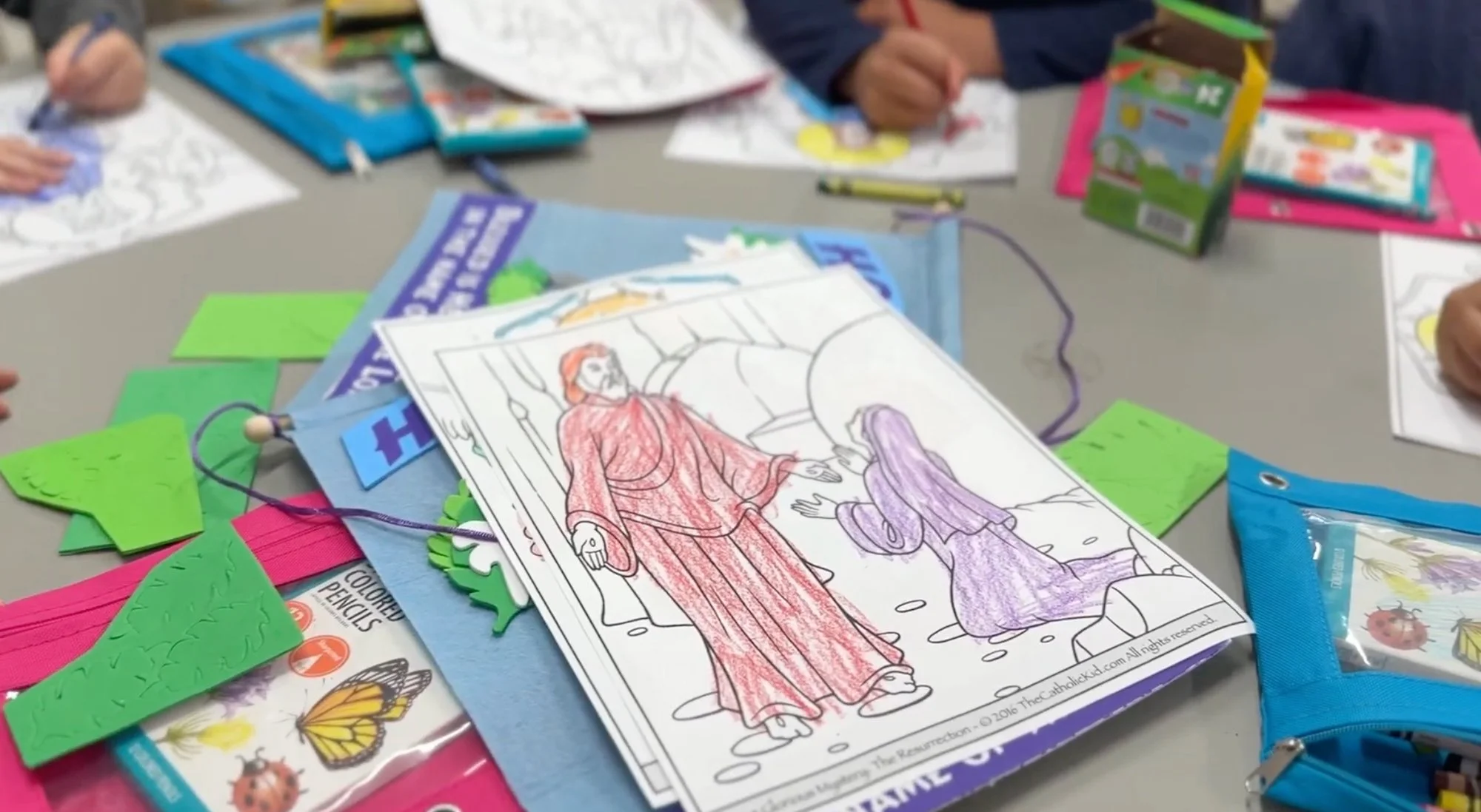 Children's drawings of the Virgin Mary at a religious education class