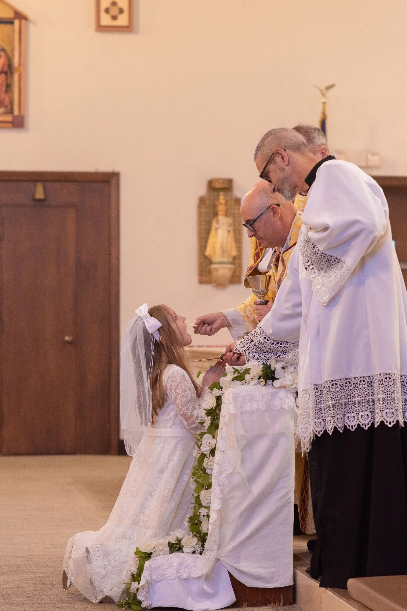A young girl receiving her First Holy Communion at St Eugene's Cathedral