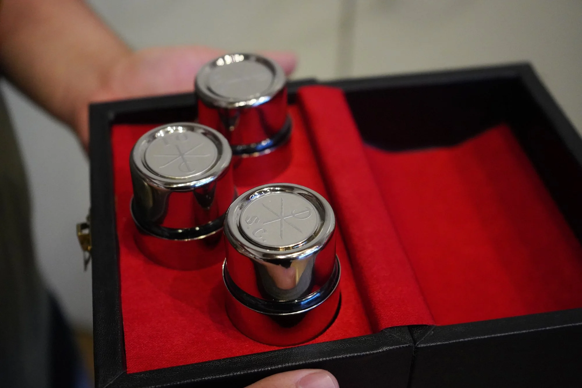 Set of three anointing oils in a red velvet lined box