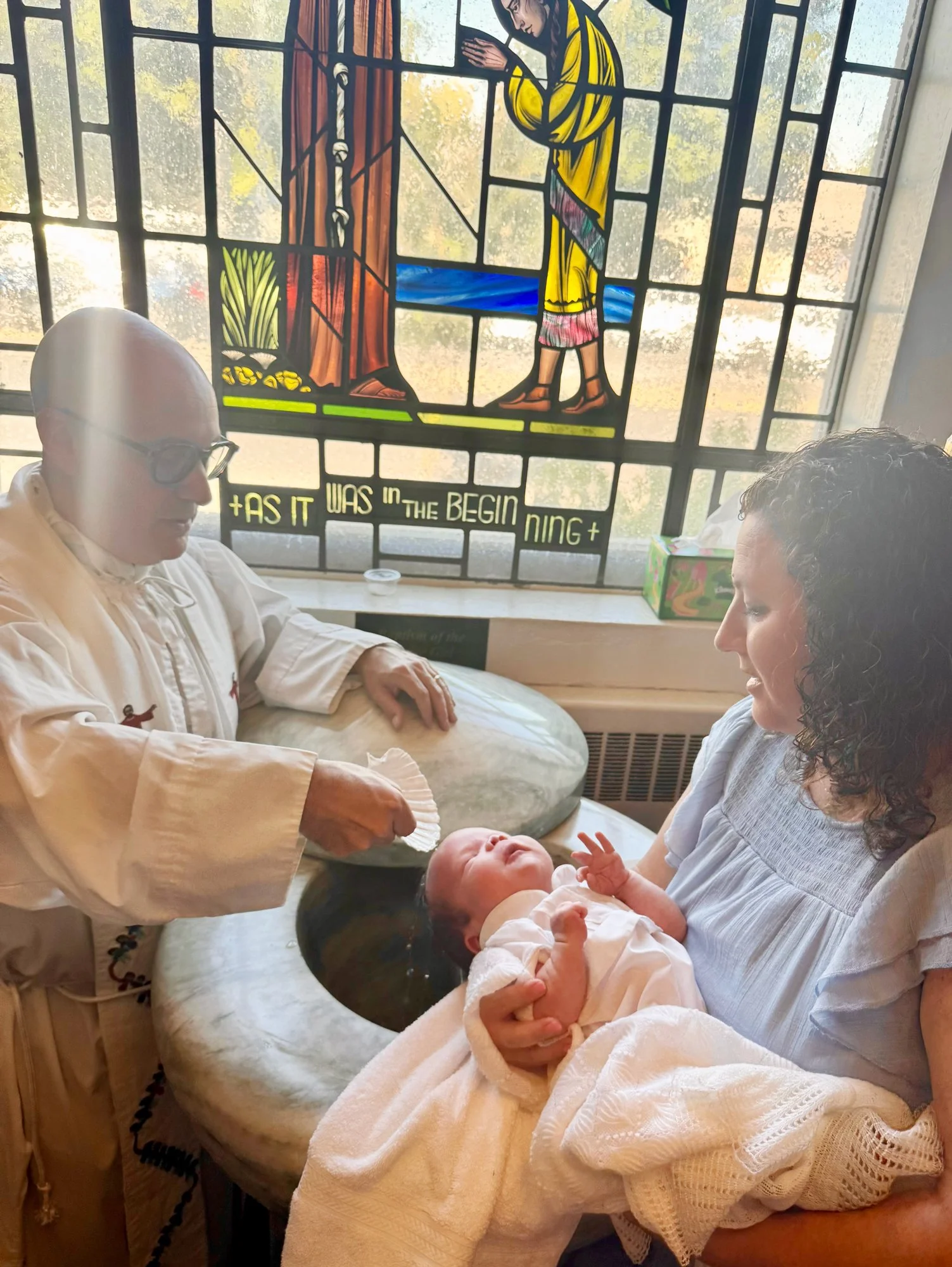 A baptism ceremony taking place inside the Cathedral of St Eugene