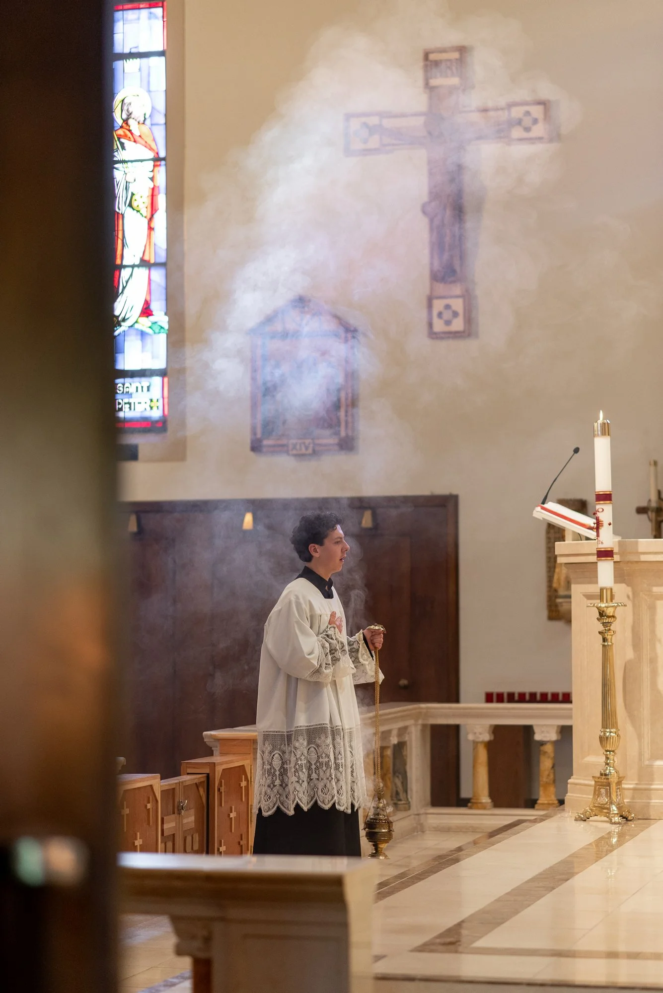 Altar server holding incense at the altar of the Cathedral of St Eugene in Santa Rosa