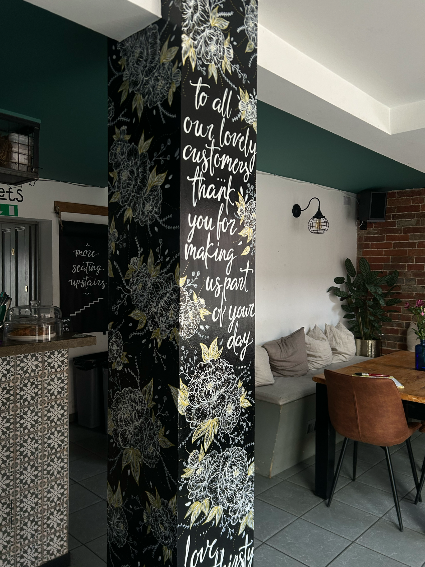 Hand painted floral pillar mural with signage to align with branding for The Bird, Wimborne.