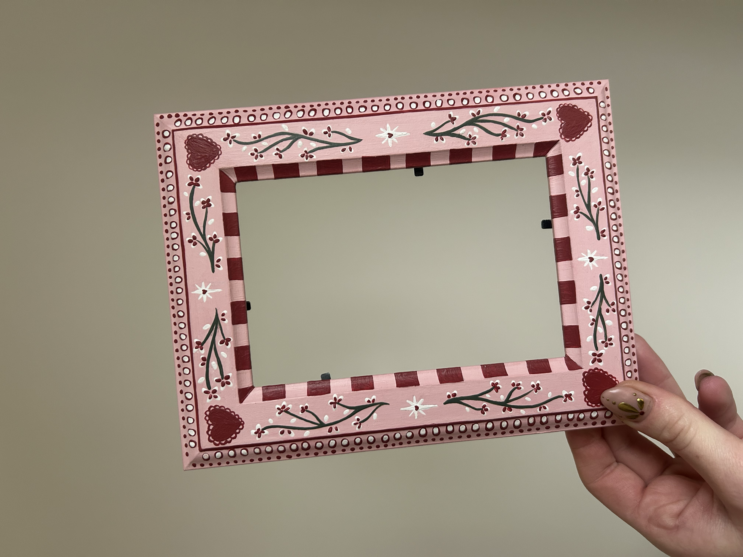 Bespoke hand painted wooden frame.
