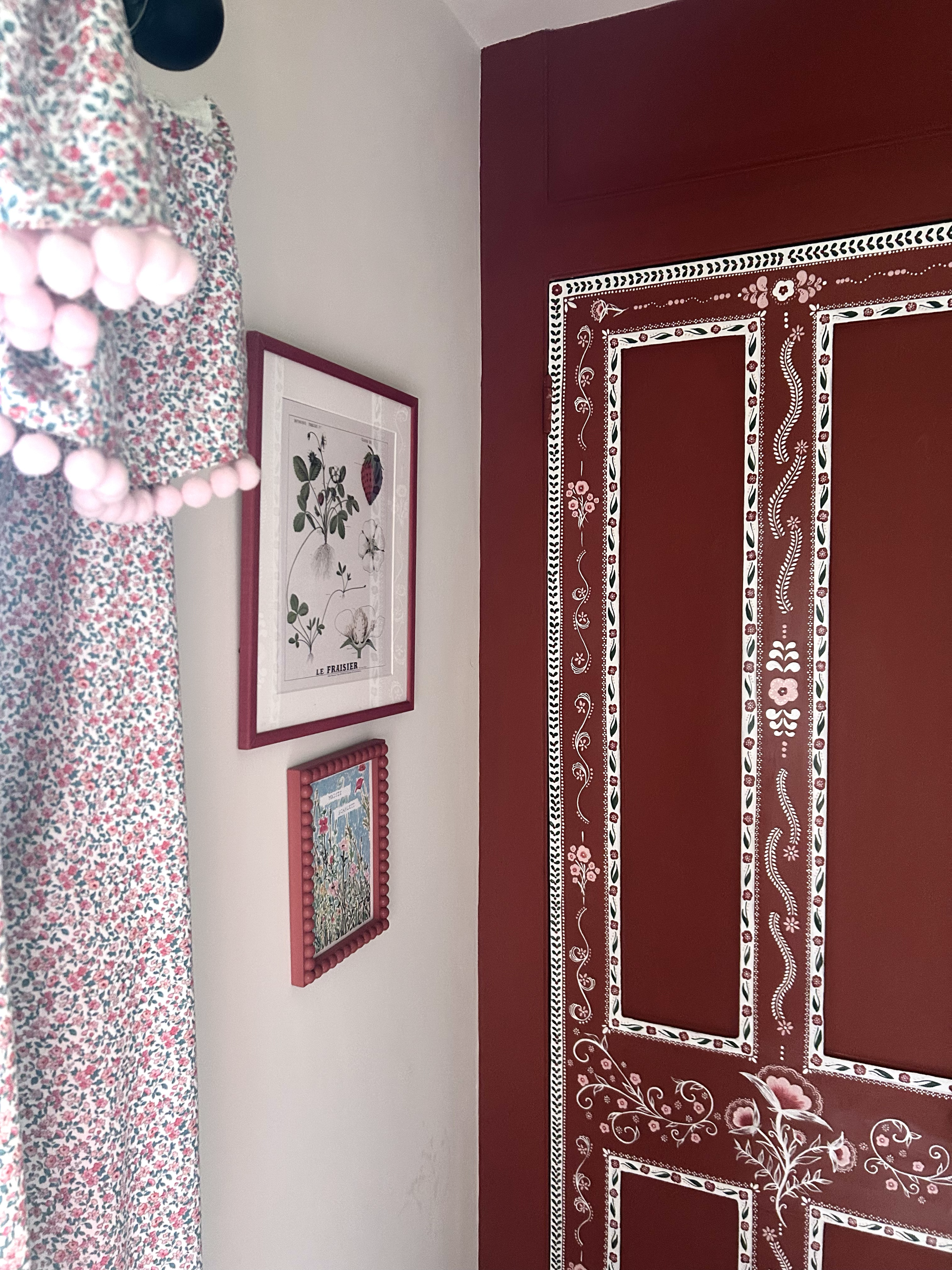 Close up of floral folk art style hand painted doors as a matching pair for kids bedroom.