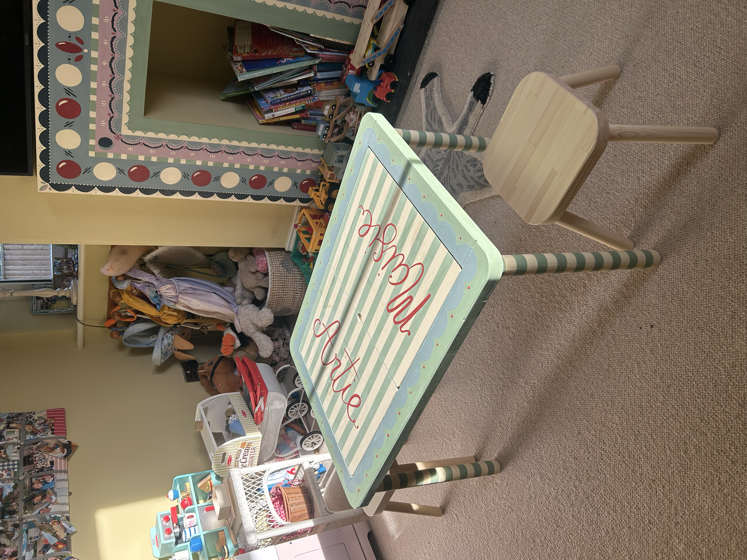 Bespoke hand painted kids table with personalisation of names.
