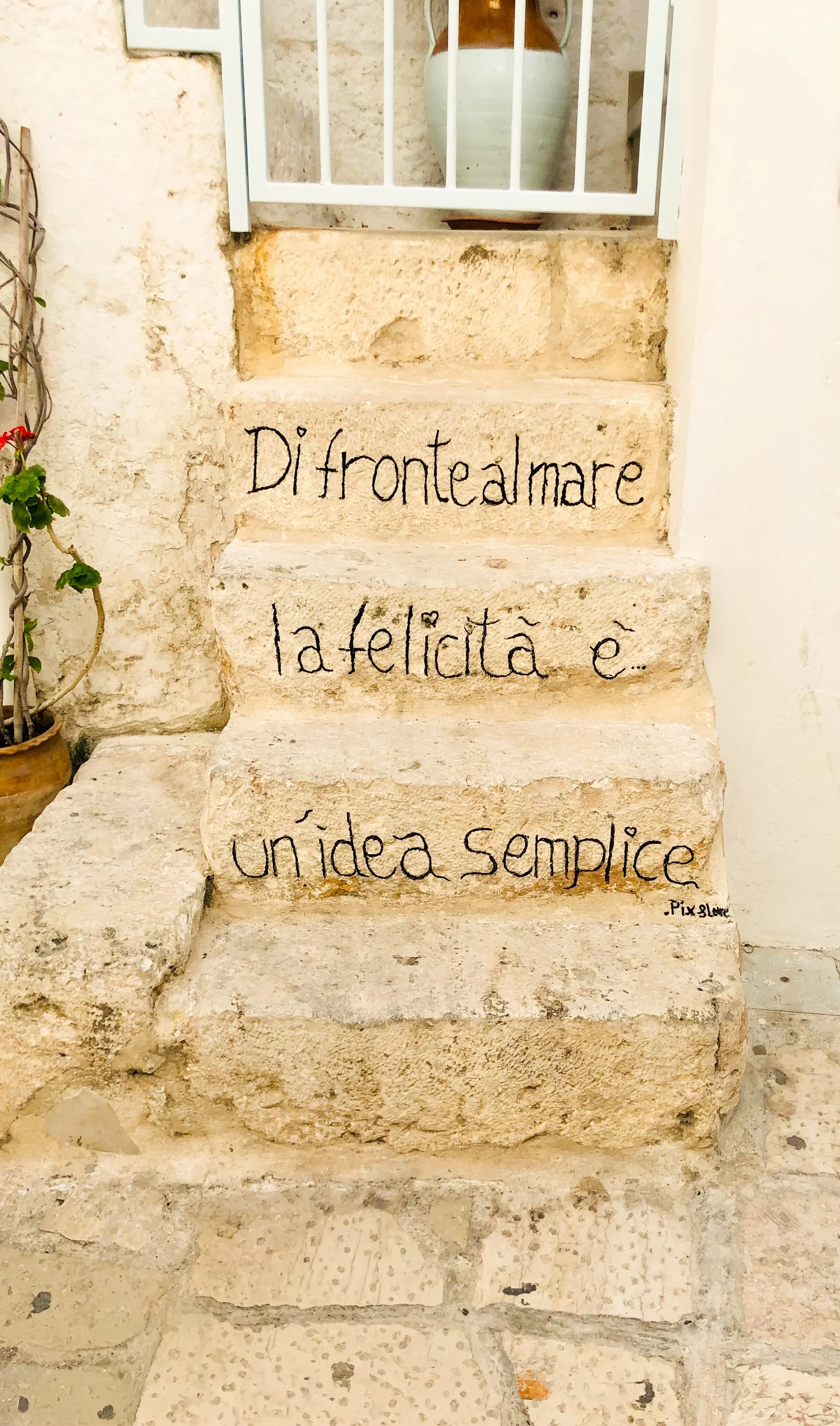 On the steps of a home in Polignano al Mare some joyful graffiti is written - "Di fronte al mare, la felicità è in idea semplice" - facing the sea, happiness is a simple idea. Nothing truer could be said of Puglia.