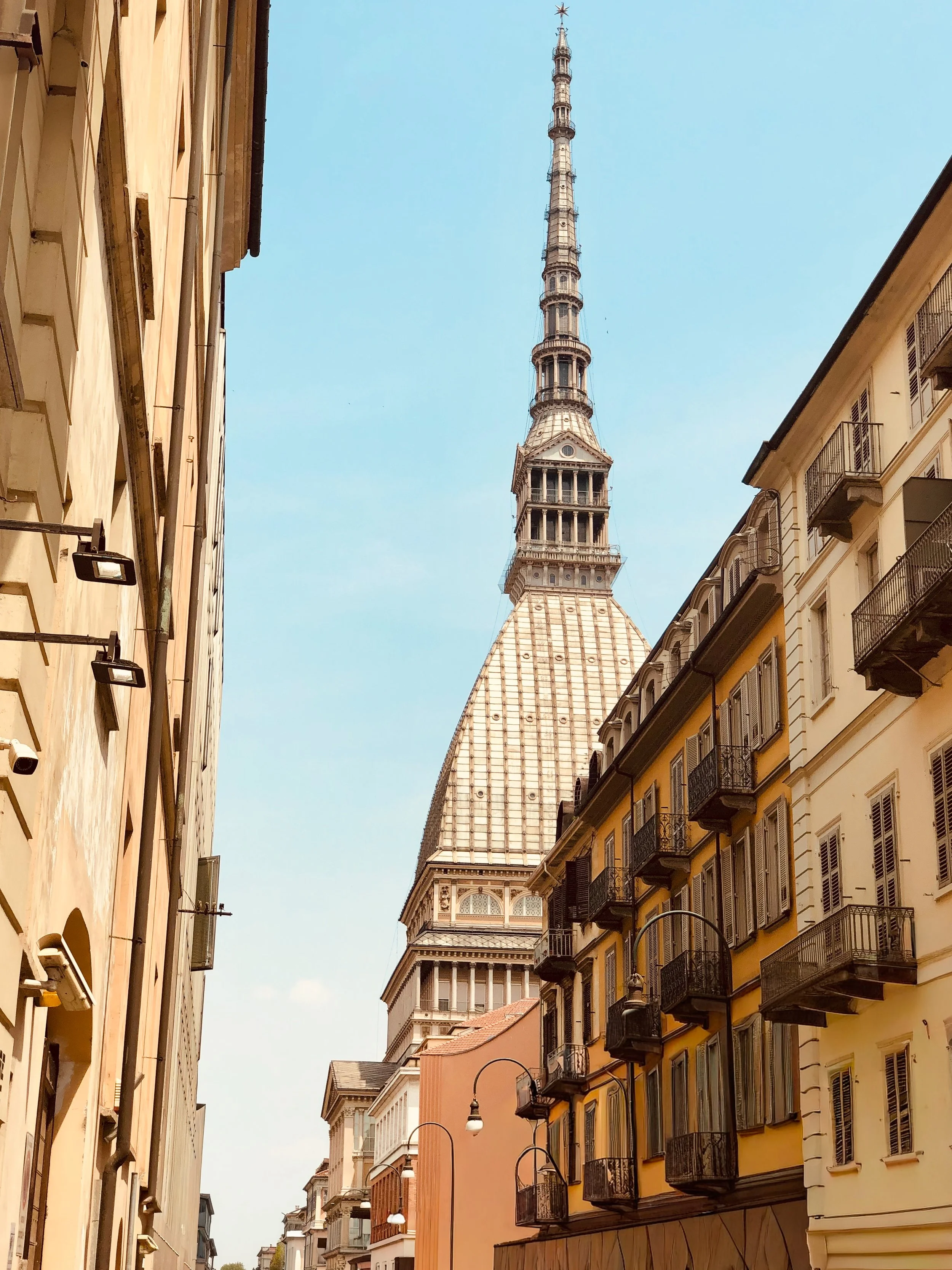 The elegant European feel of the streets of Torino are highlighted by the spire of the Mole Antonelliana which houses the Museum of Cinema.