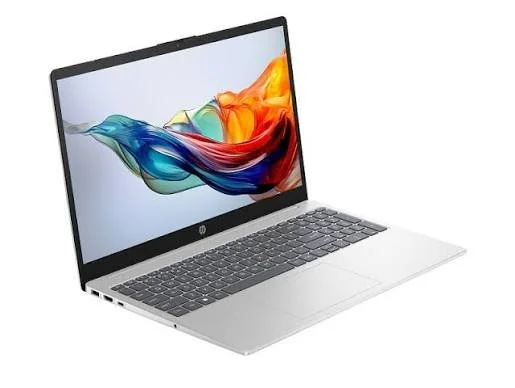 Silver laptop computer with a colorful abstract wave wallpaper on the screen, open and angled to the right.