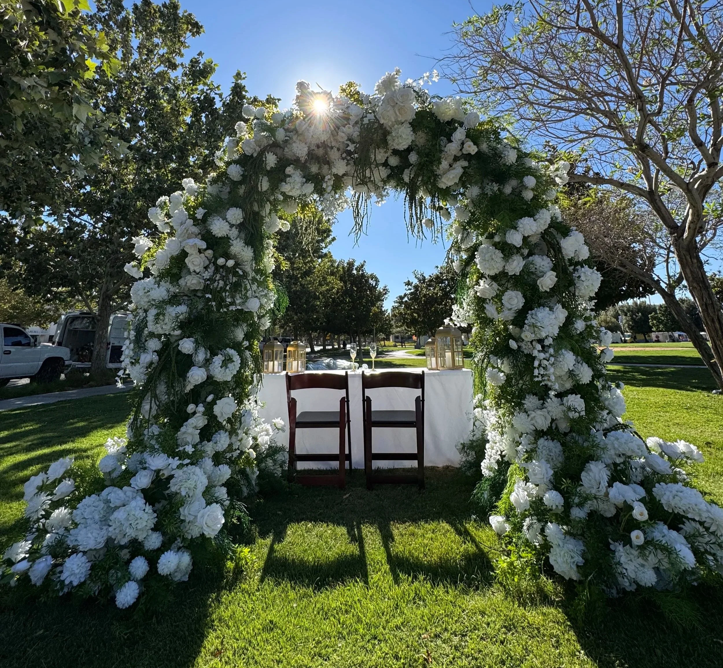 Floral Arch Sweetheart table repurpose