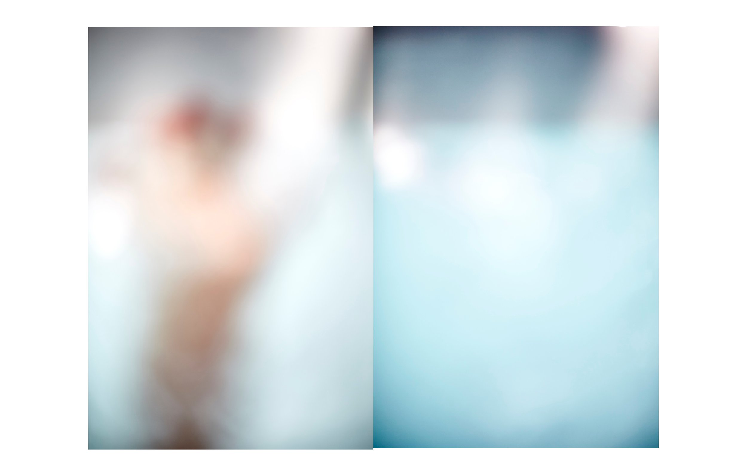 A blurred photograph of a person holding a phone, with a focus on the phone and hand, set against a light-colored background.