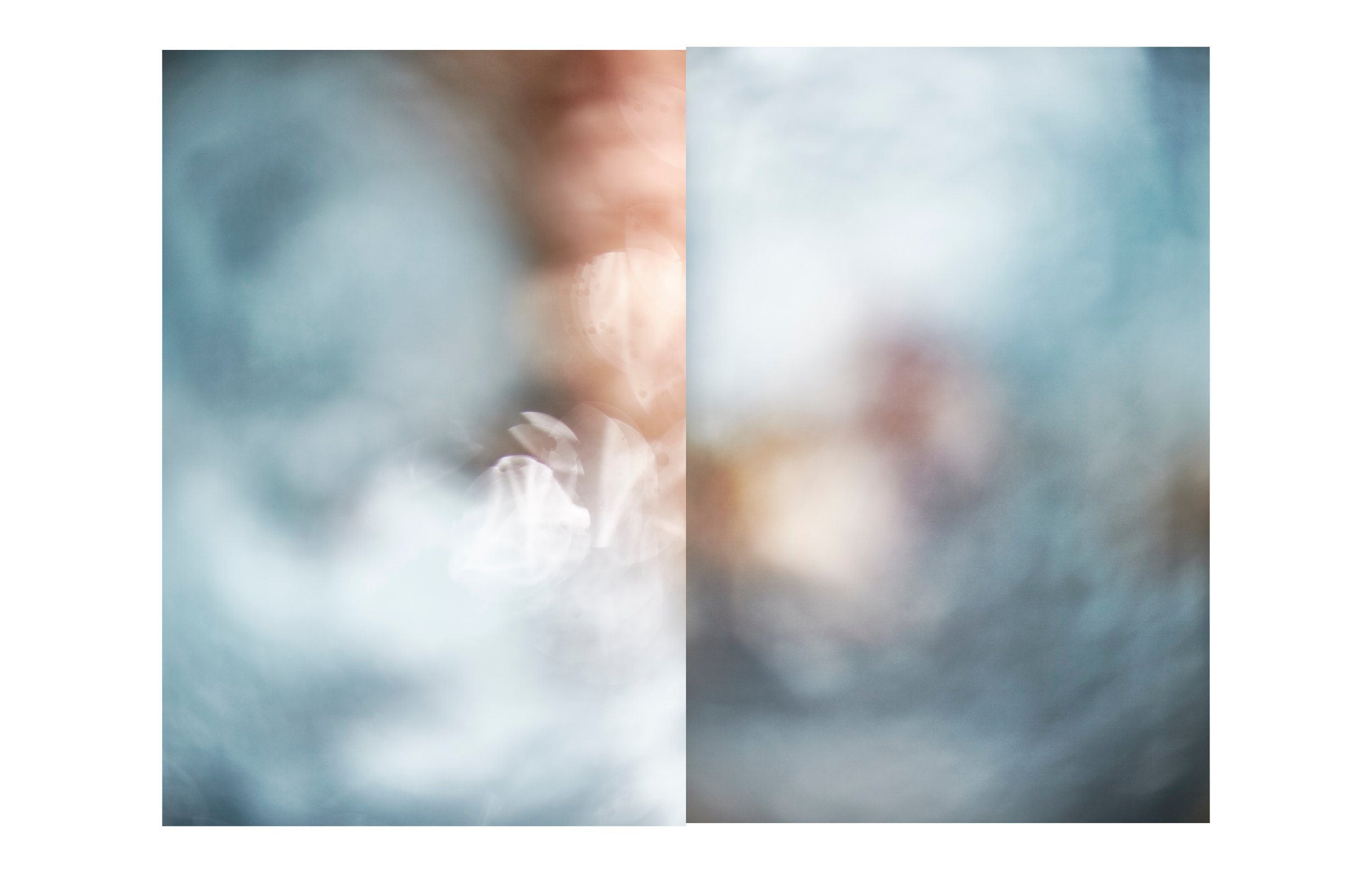 Blurred abstract image with a split down the middle; warm tones on the left and cool tones on the right.