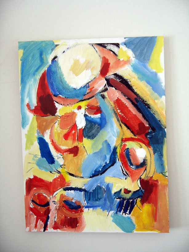 Abstract colorful painting with blue, red, yellow, and white brushstrokes on a canvas.