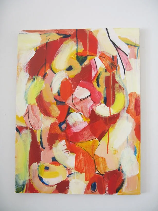 Abstract painting with bold red, yellow, pink, white, and black brushstrokes on a canvas mounted on a white wall.