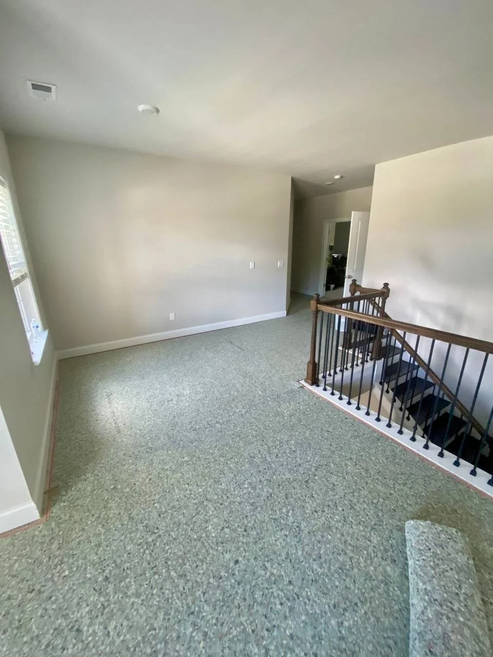 New wall-to-wall carpet installed around an upstairs landing and staircase for a fresh, comfortable finish.