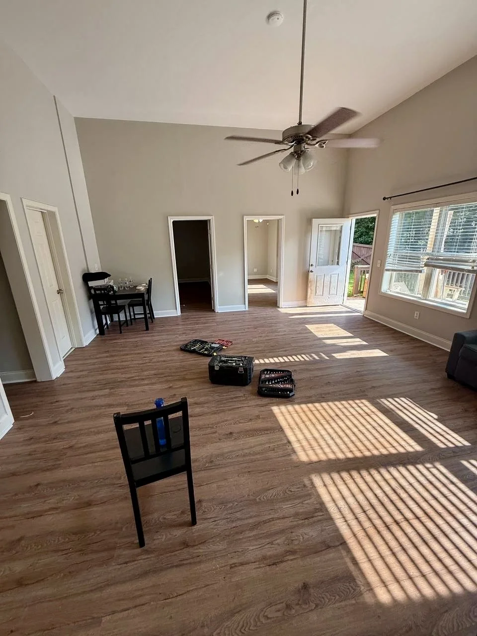 New wood-look flooring installed throughout a spacious living area for a clean, durable, updated finish.