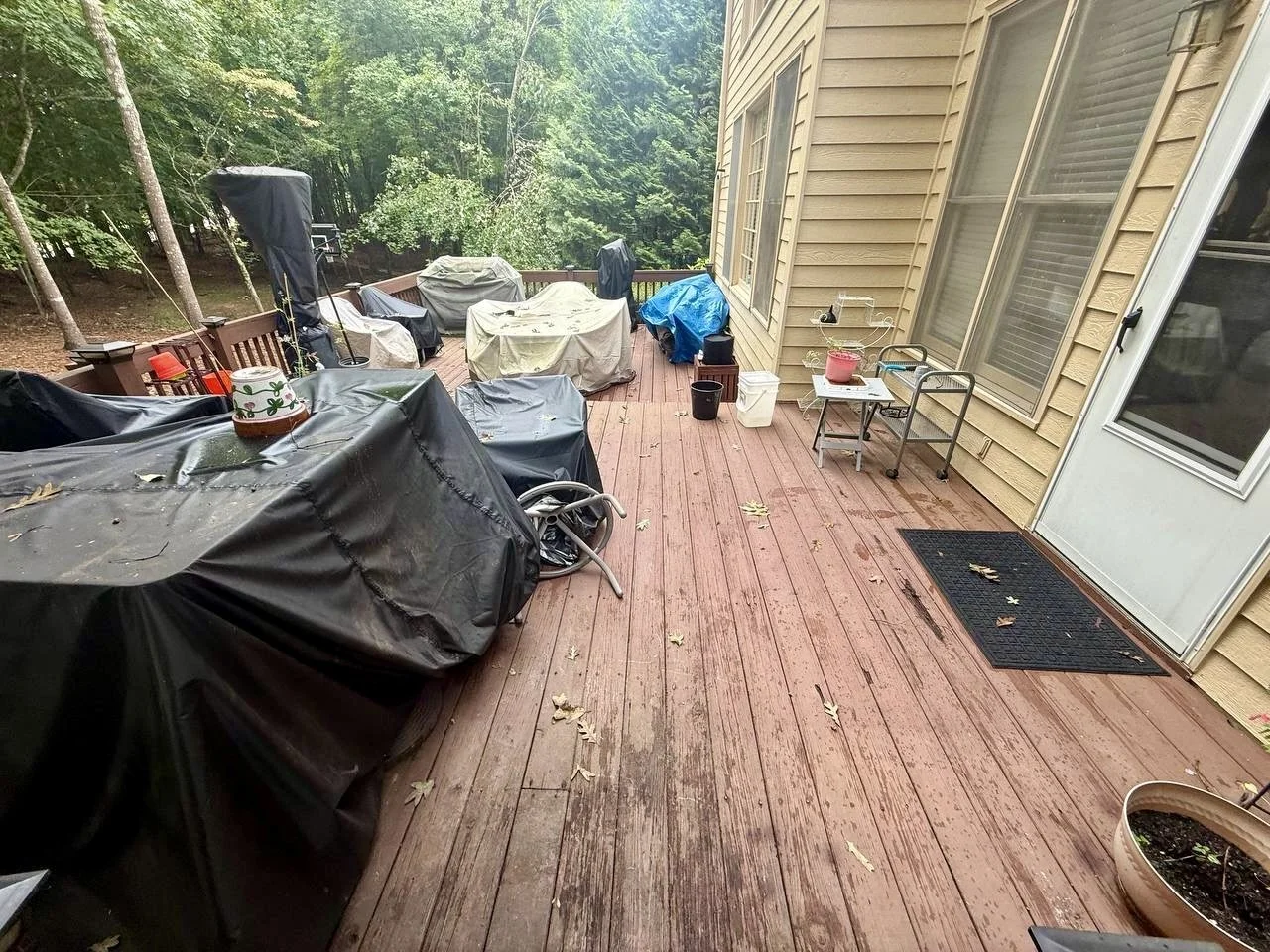 Before view of the existing wood deck showing weathering and wear prior to restoration and refinishing.