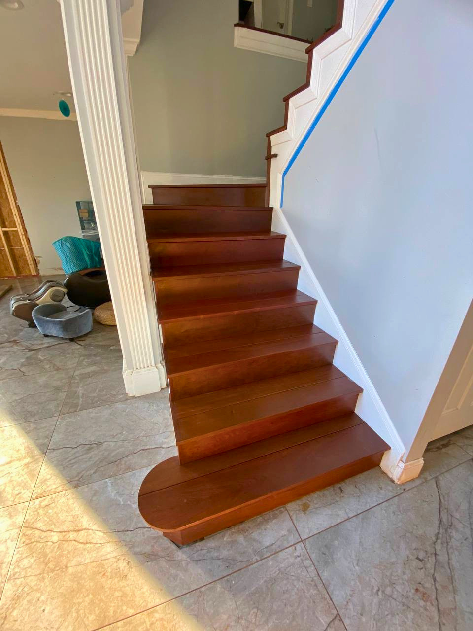Completed staircase featuring rich wood treads and risers for a durable, polished upgrade.