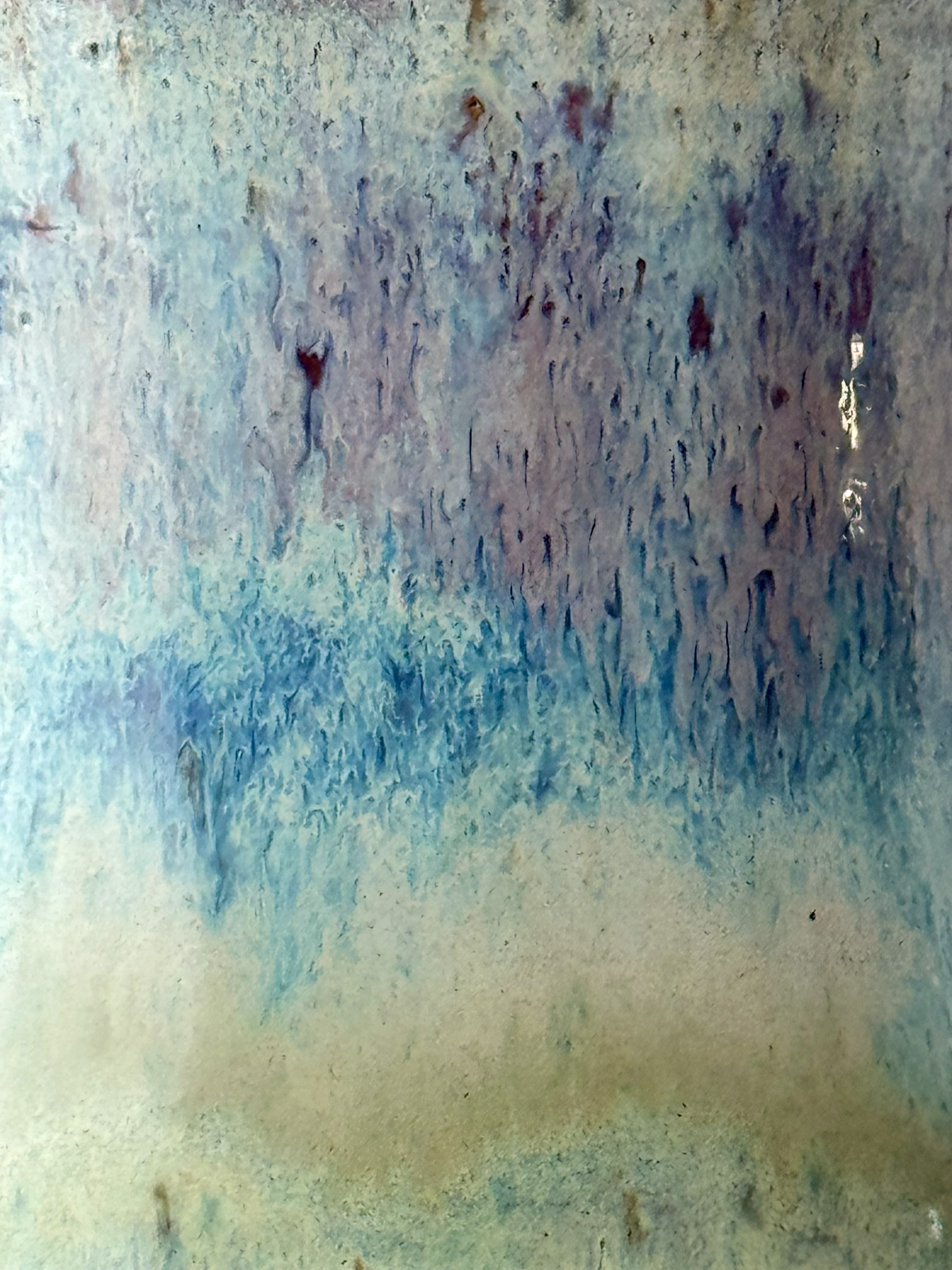 Close-up of glaze with blue, green, and purple hues