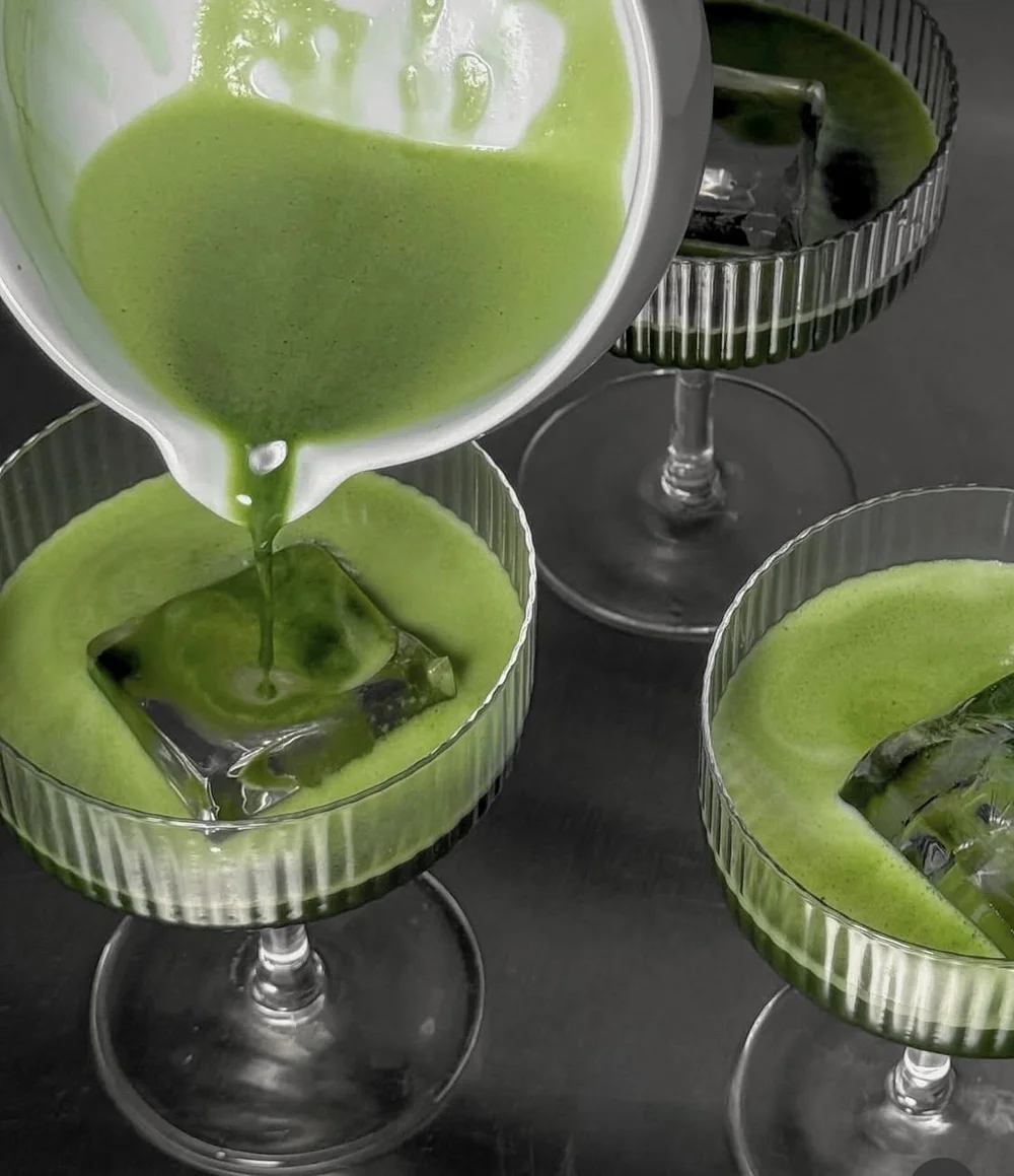 Iced ceremonial matcha lattes dusted with matcha powder