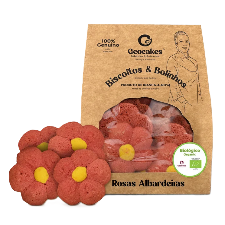 Biscoitos biológicos Rosas Albardeiras da Geocakes, em forma de flor, junto da embalagem kraft.