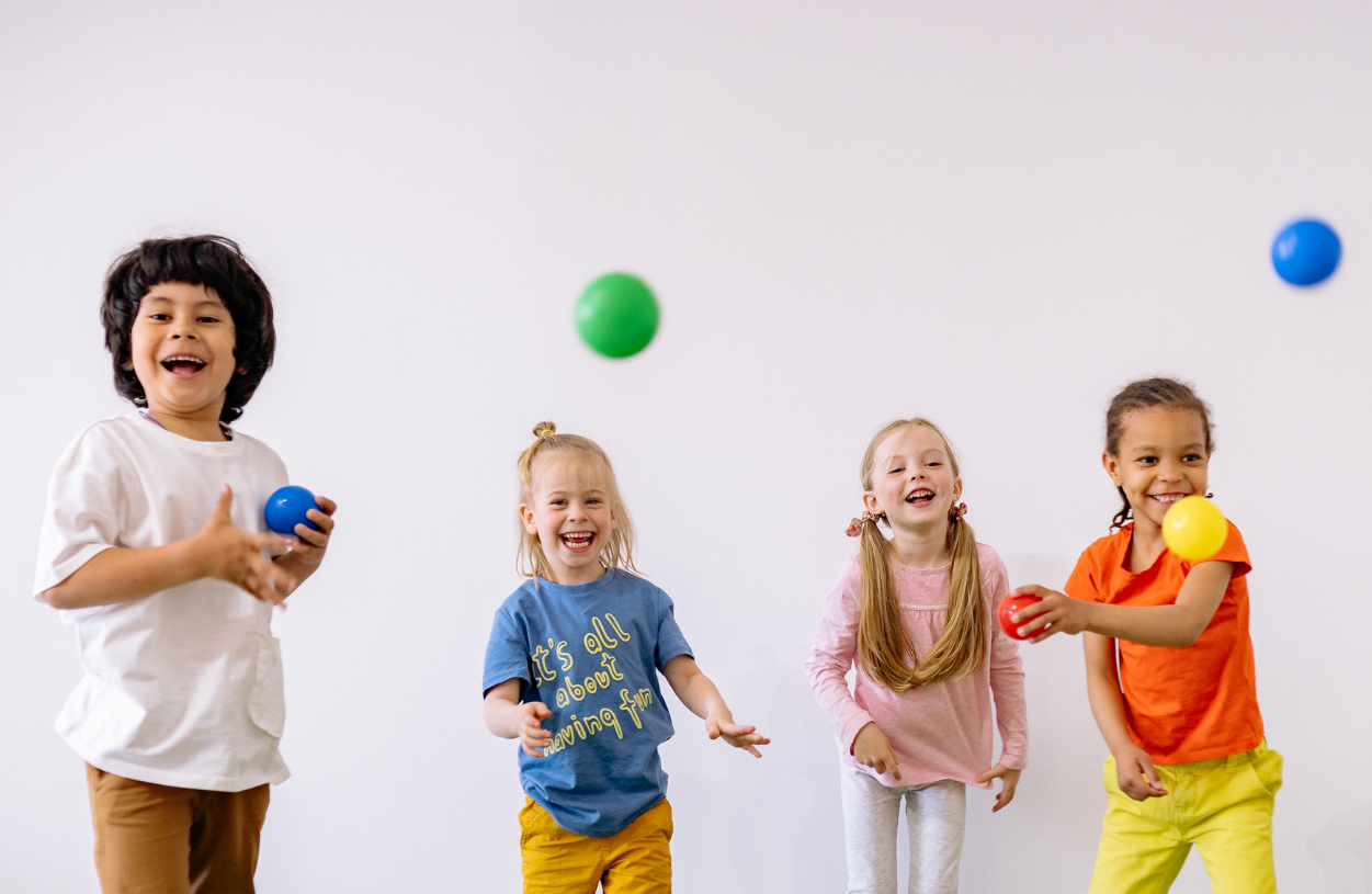 Child playing with colourful building blocks at a children’s activity