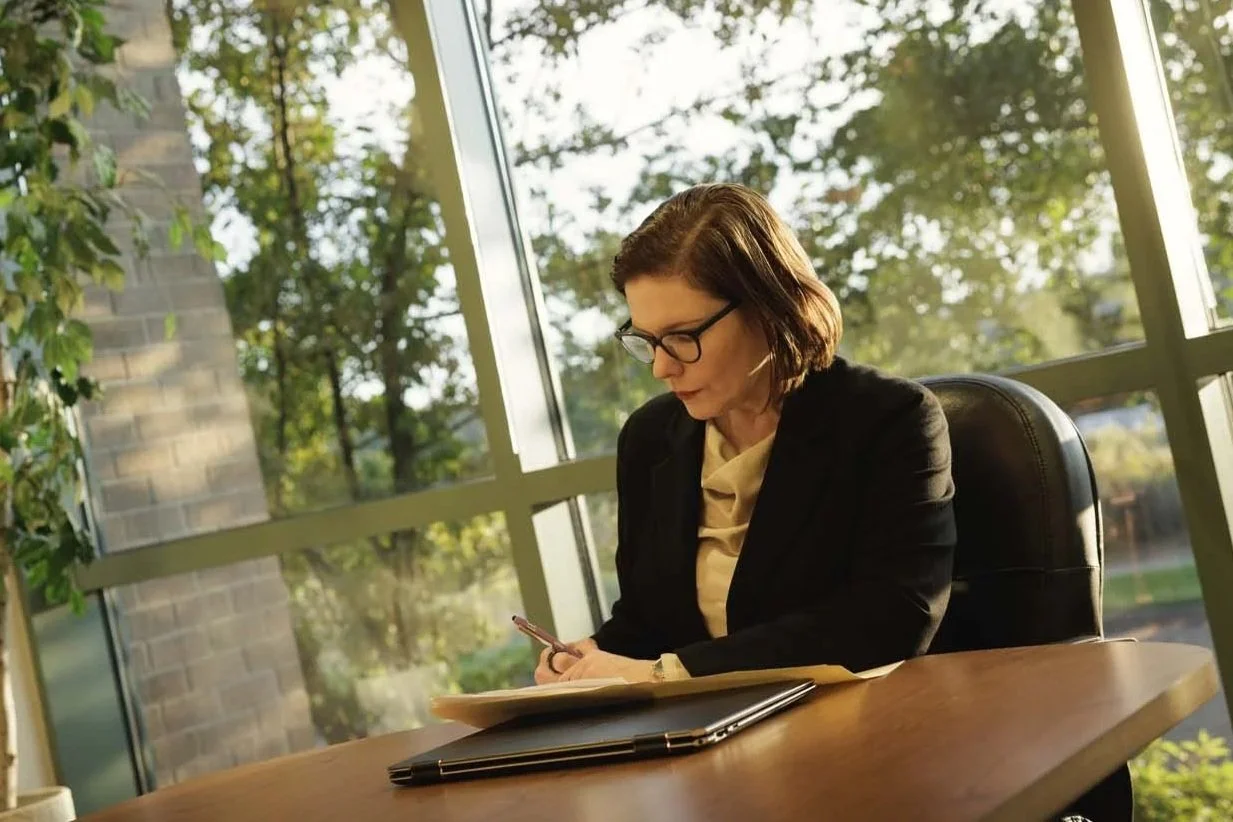 Sonia Huntsman at desk