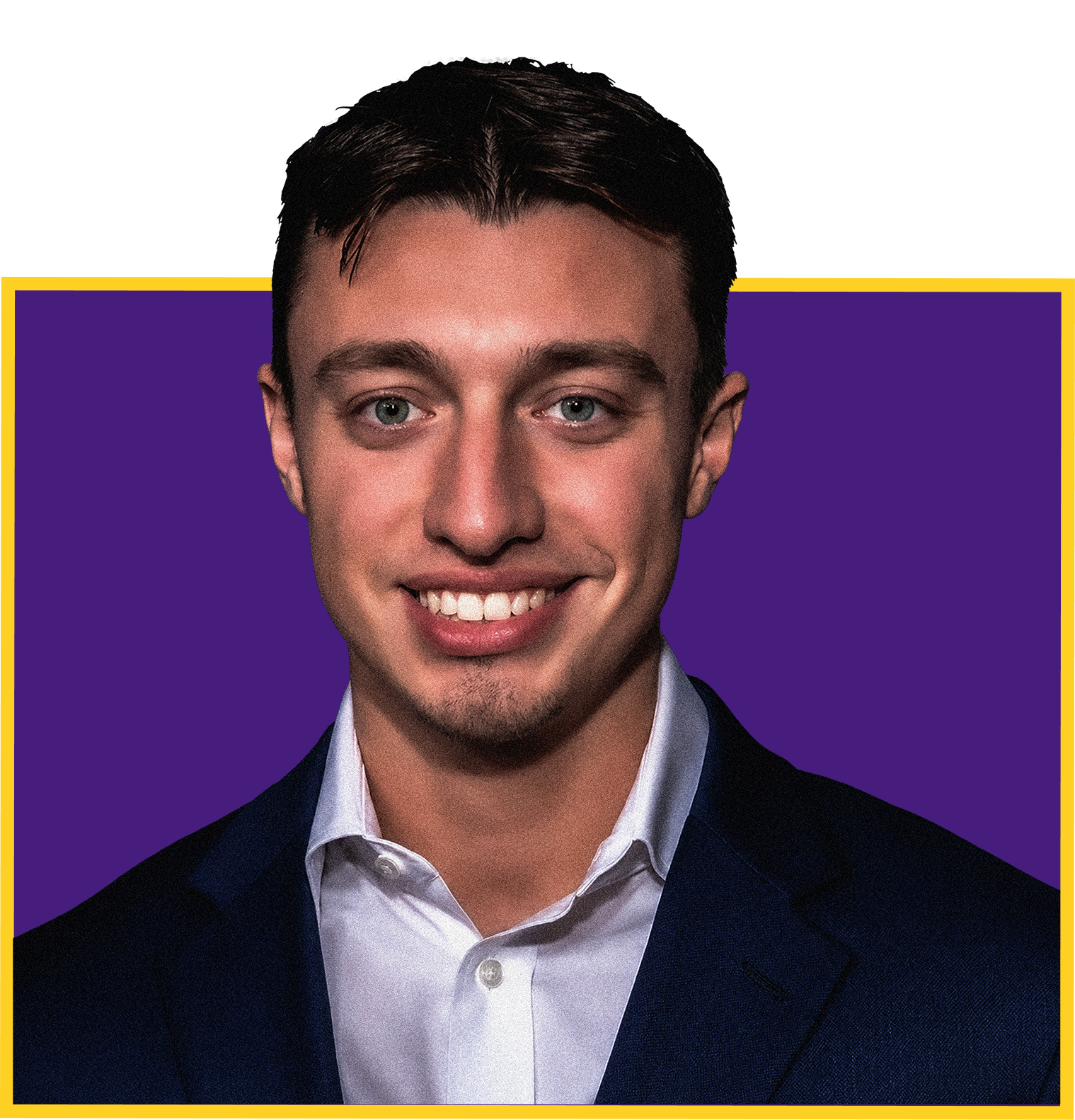 Close-up of a young man smiling, wearing a dark suit and white shirt, with a purple background and yellow border.