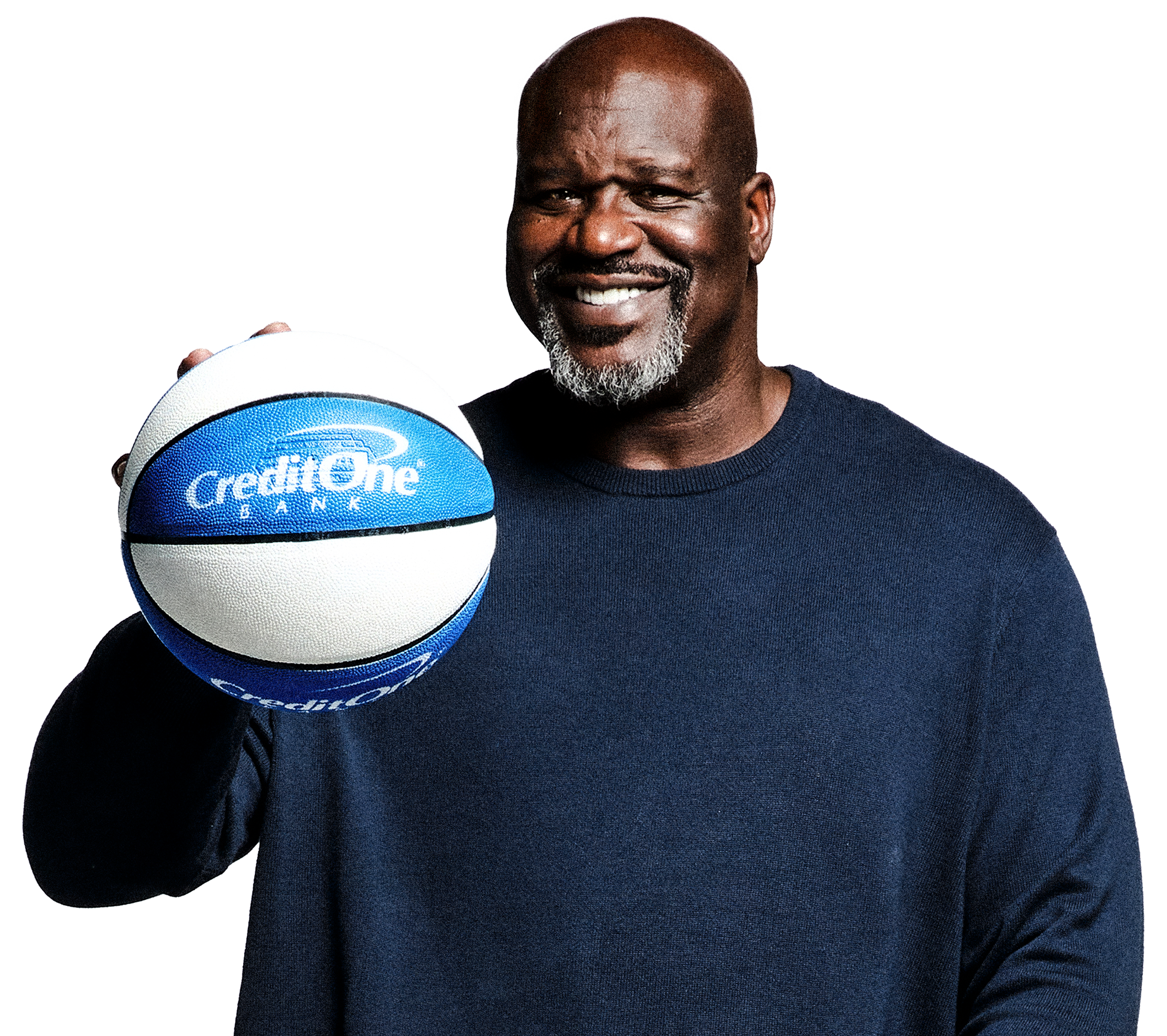 An older man smiling and holding a basketball with the Credit One Bank logo on it.