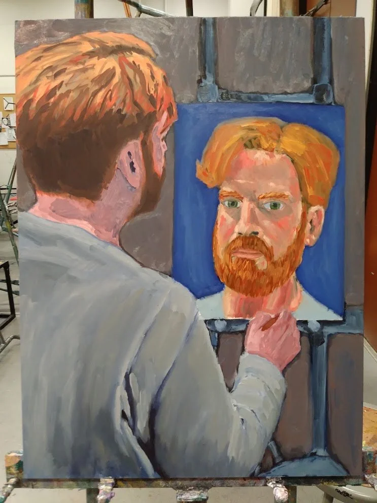 An artist painting a portrait of a red-haired man with a beard, wearing a white shirt, as seen from behind.