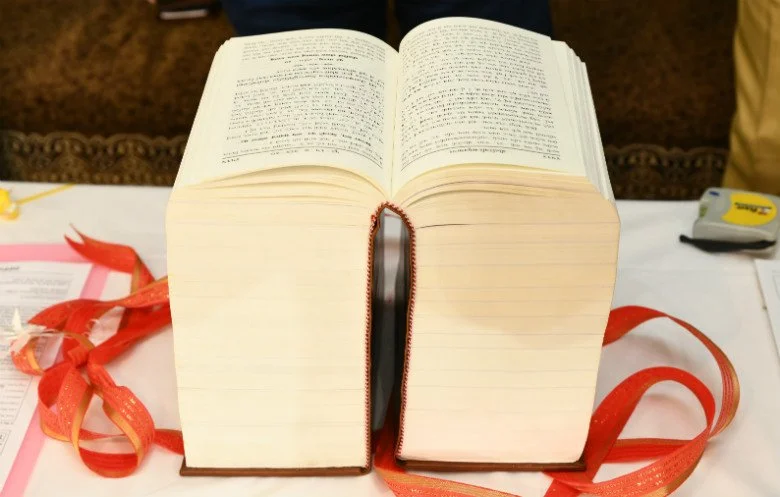 An image showing the thickest book ever published as of August 2026. Gyanjivandasji Swami, 496mm