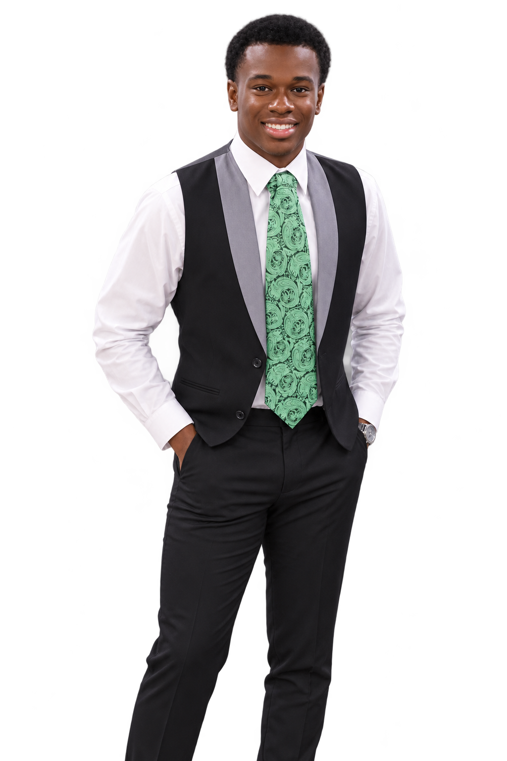 A young African-American man wearing a white dress shirt, black vest with gray lapels, black dress pants, a green patterned tie, and a watch, smiling and standing with hands in pockets against a blurred dark background.
