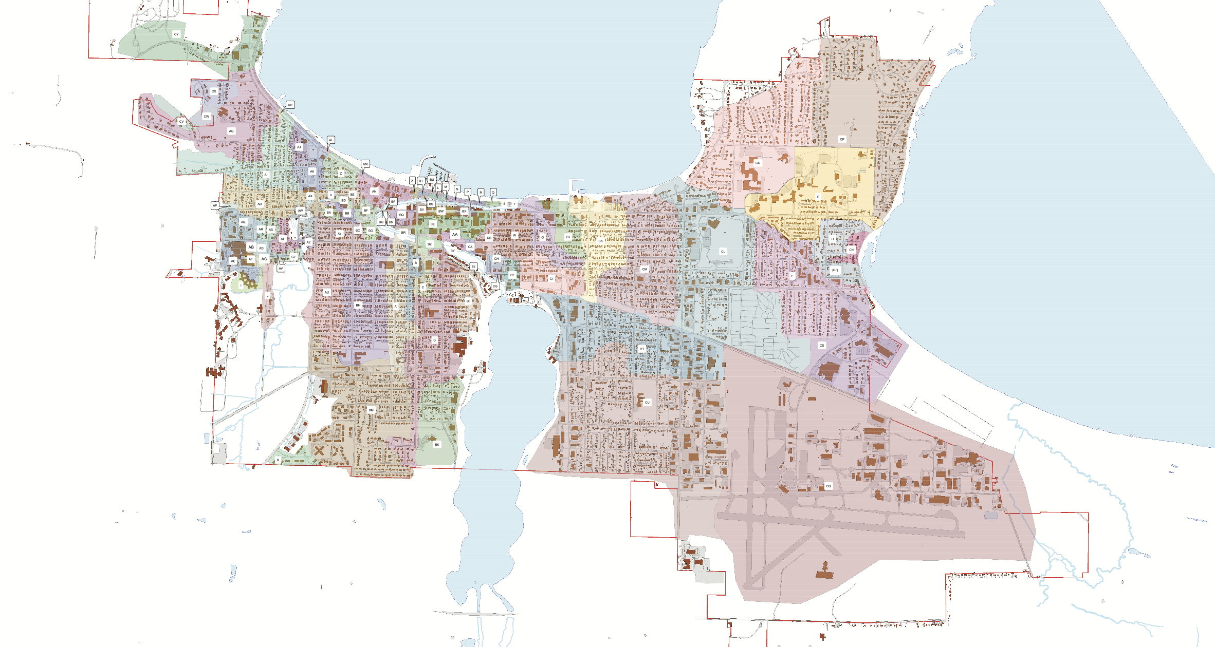 Color-coded map of a city with lakes, water bodies, and land areas divided into various zones marked with letters and outlined with red borders.