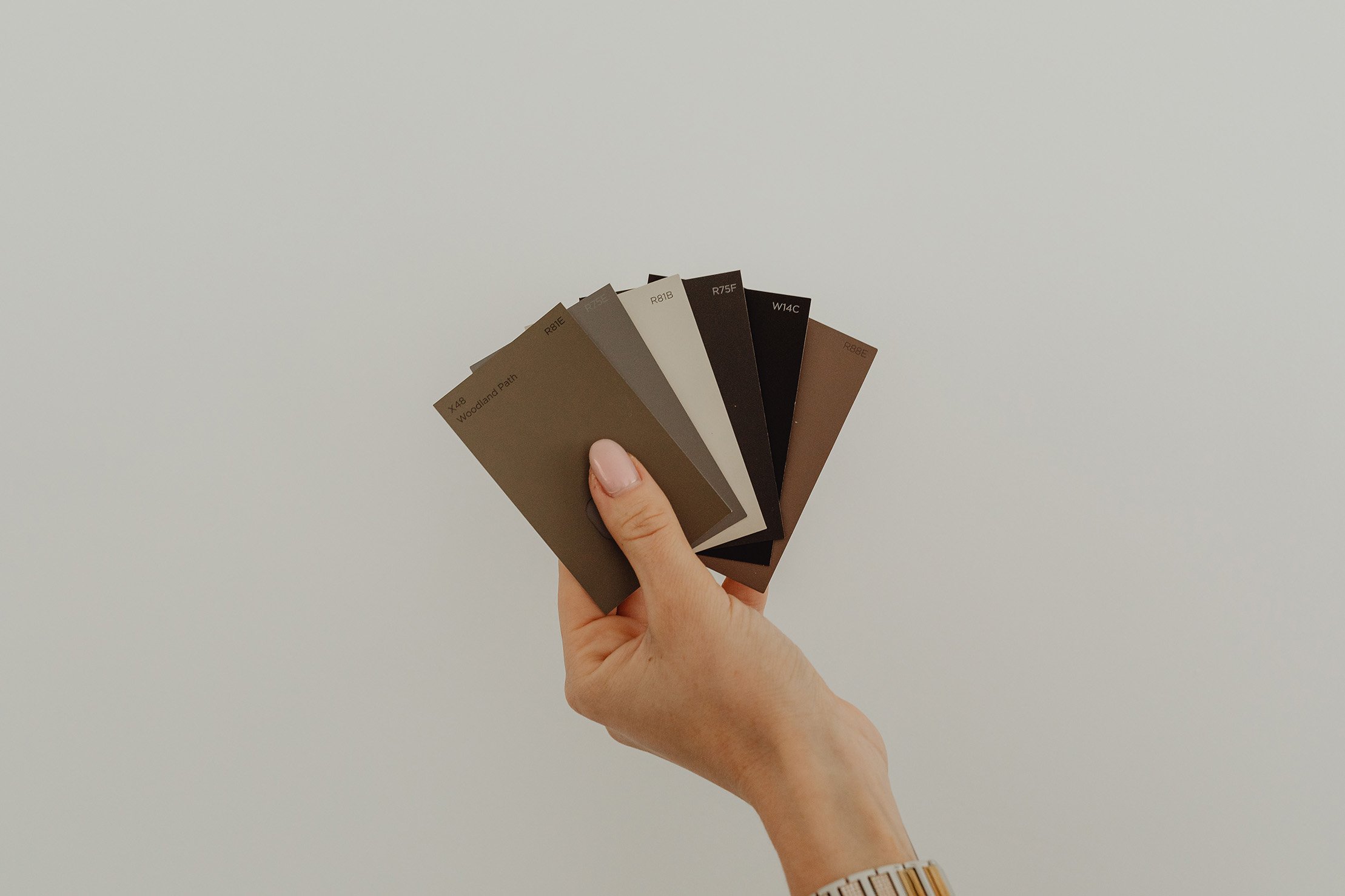 Woman Holding Paint Colors