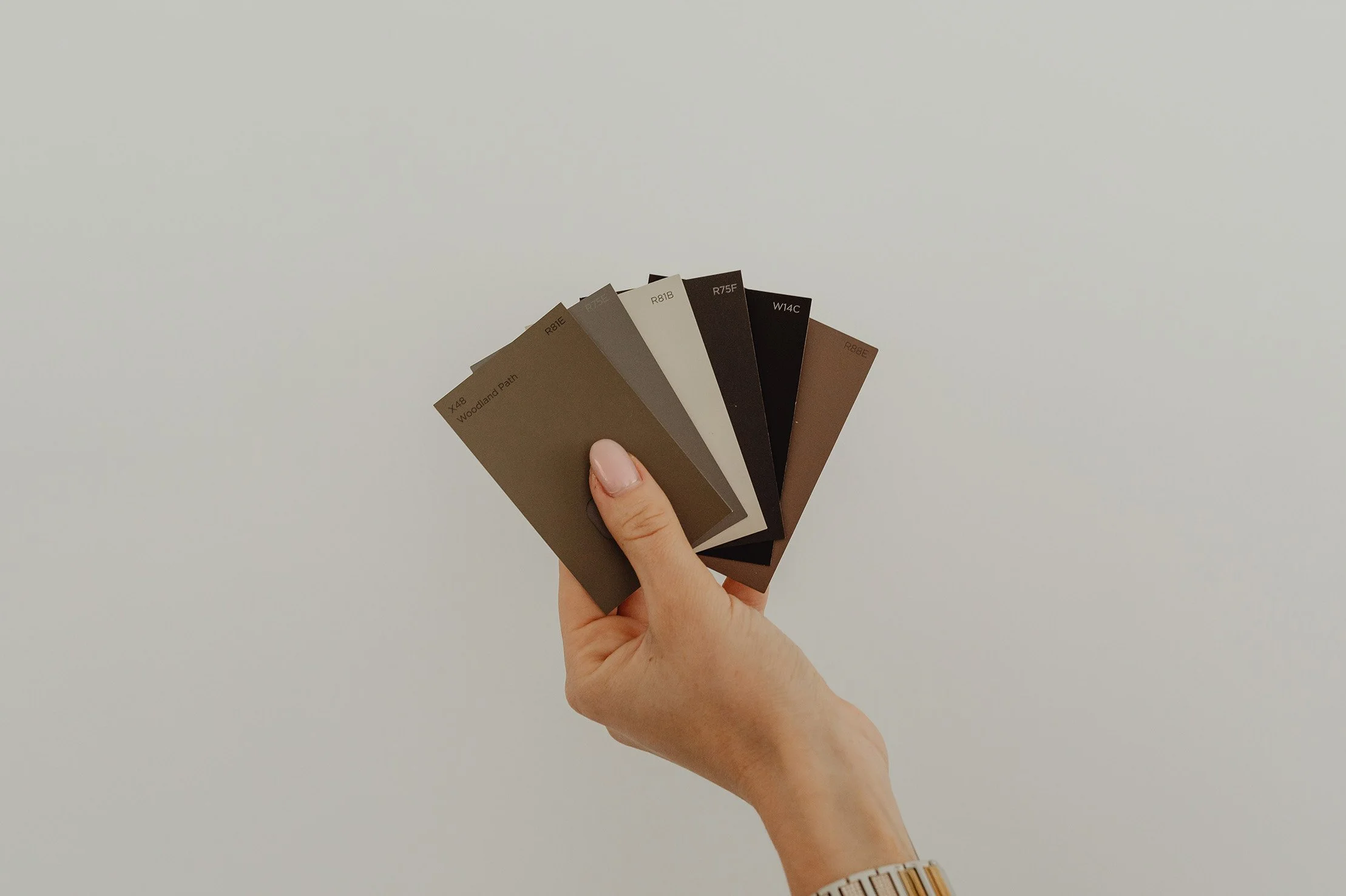 Woman Holding Paint Colors