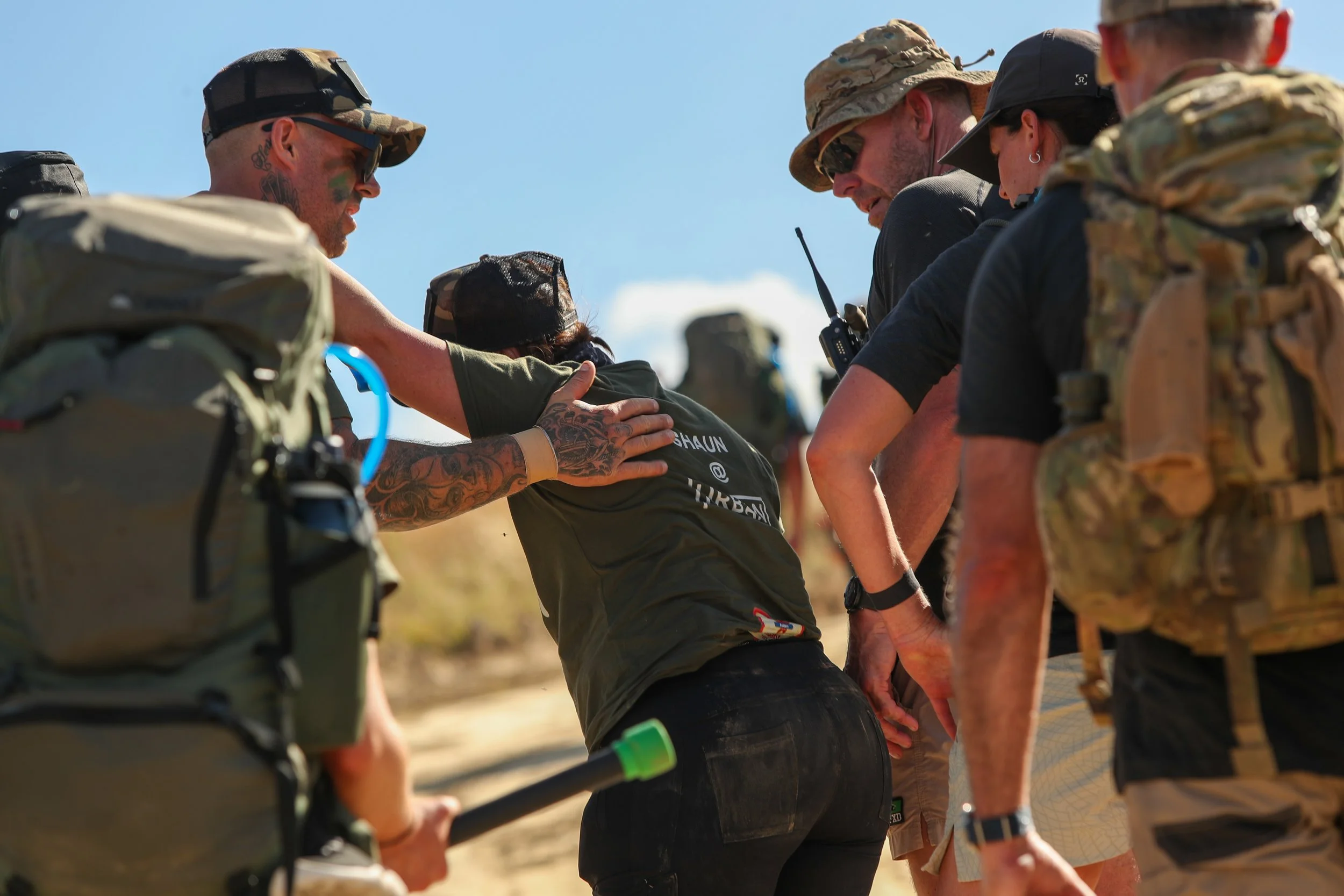 30 Unbroken participants supporting each other during a tough hike in the 30 hour challenge.