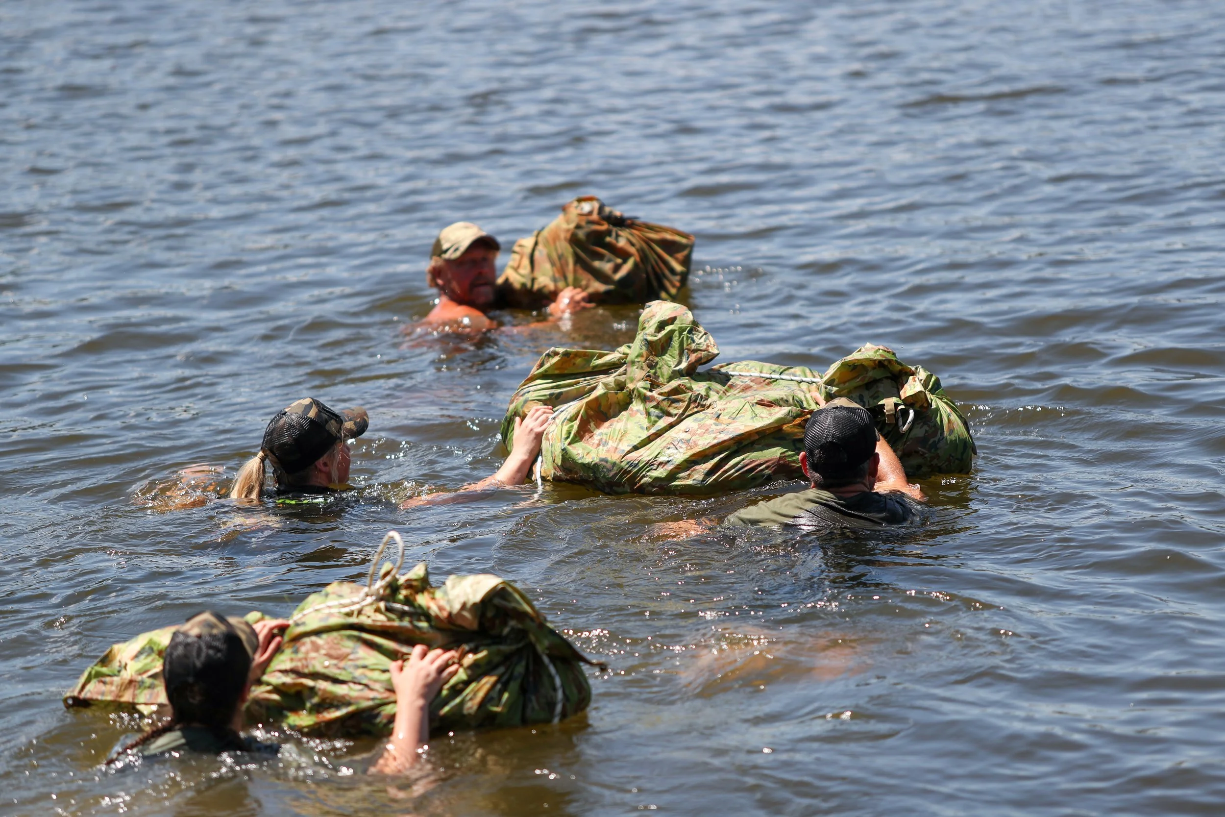 30 Unbroken participants crossing a body of water.
