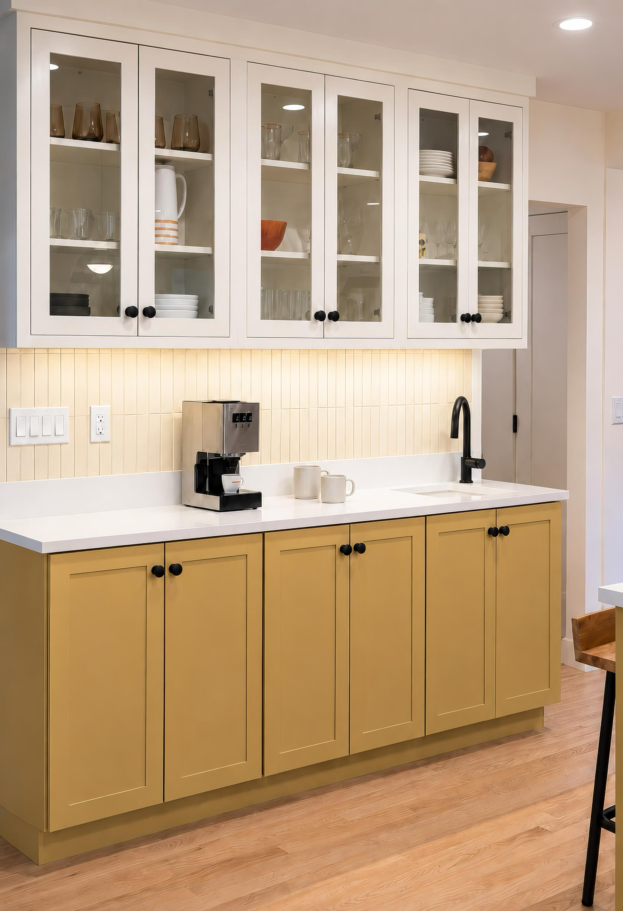 kitchen with yellow cabinets at the bottom and white display cabinets at the top