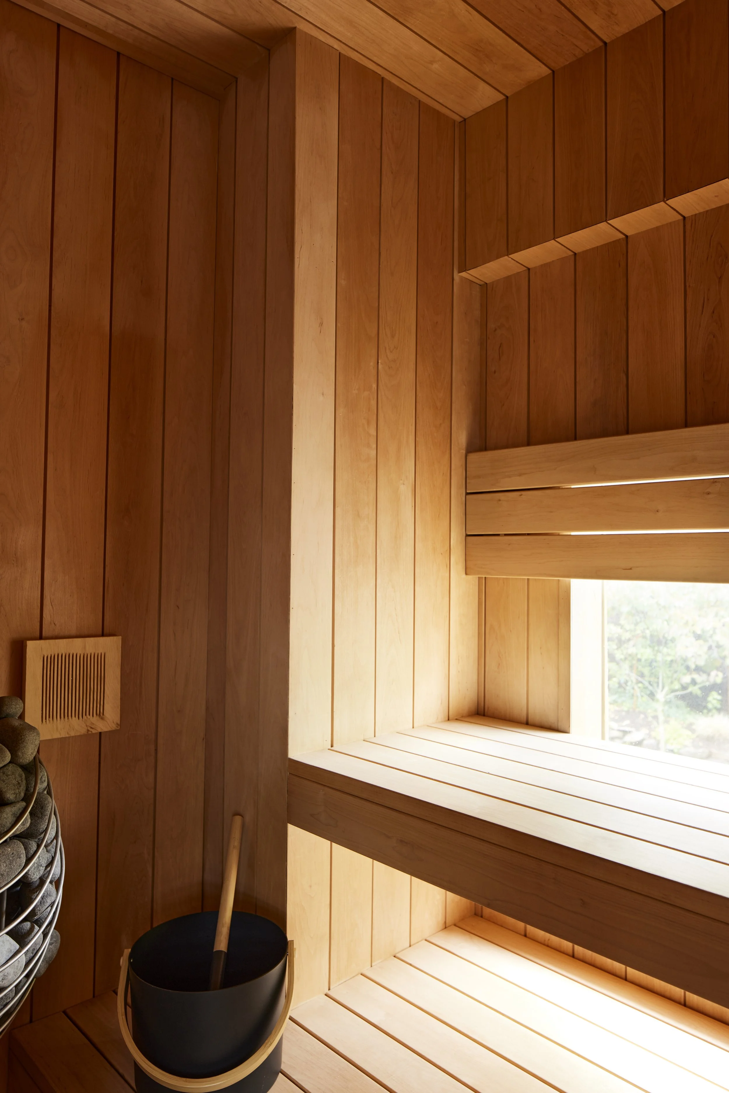 close up image of wood panel sauna interior