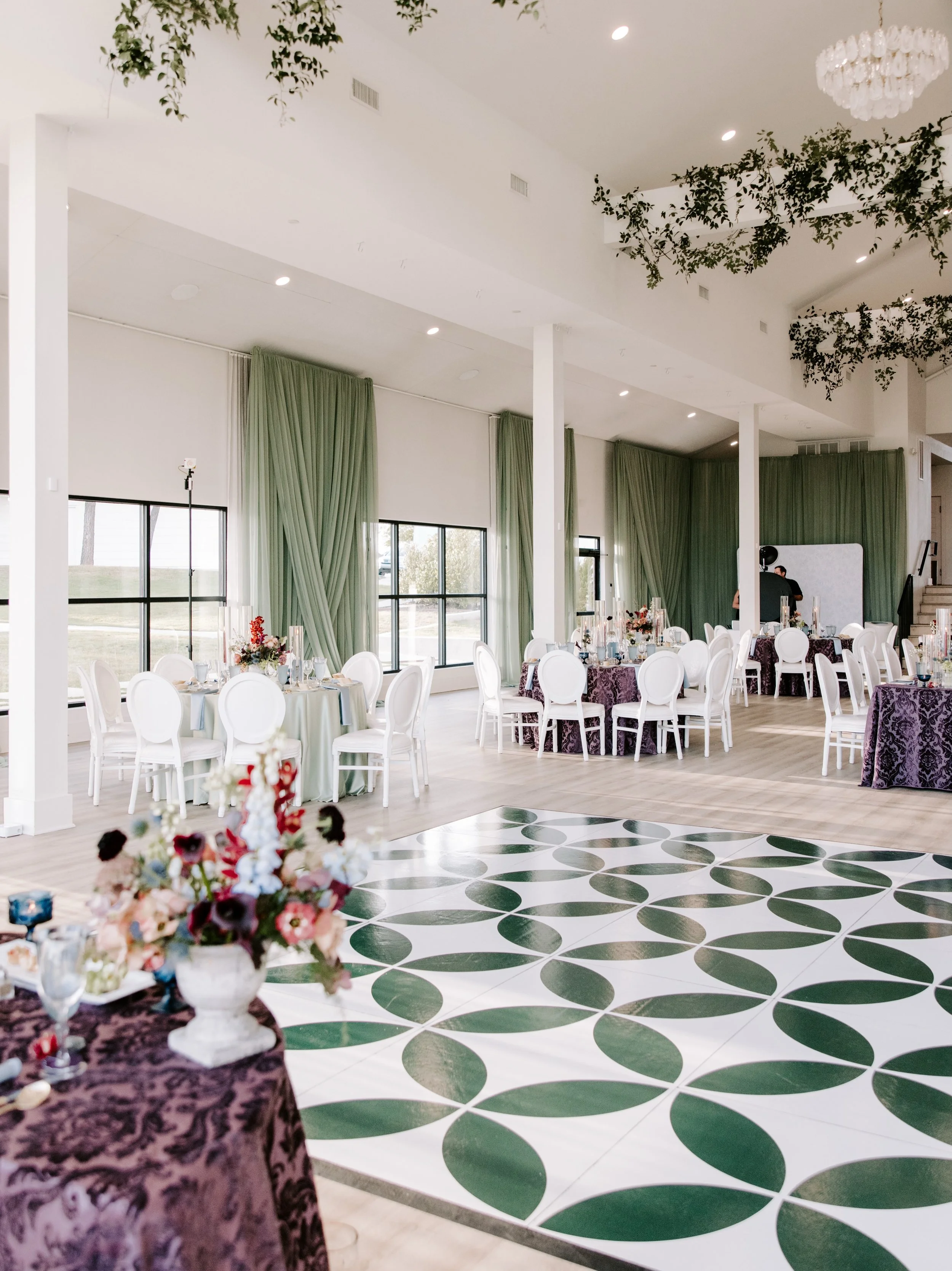 Oh you guyssss. This wedding was just SO good. The custom dance floor, fun linens, green draping, perfect florals, all the greenery, the vibes, the photos, and an absolutely incredible vendor team. Like, what else could you want?! Someone take us bac