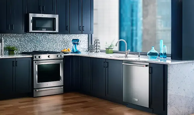 Modern kitchen with dark blue cabinets and stainless-steel appliances