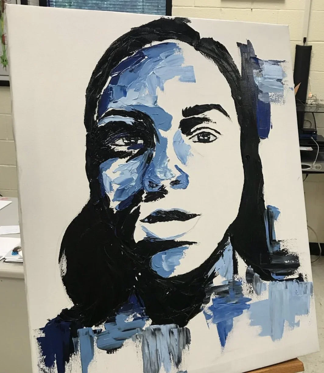 An abstract portrait painting of a woman with dark hair, painted in shades of blue, black, and white on a white canvas.